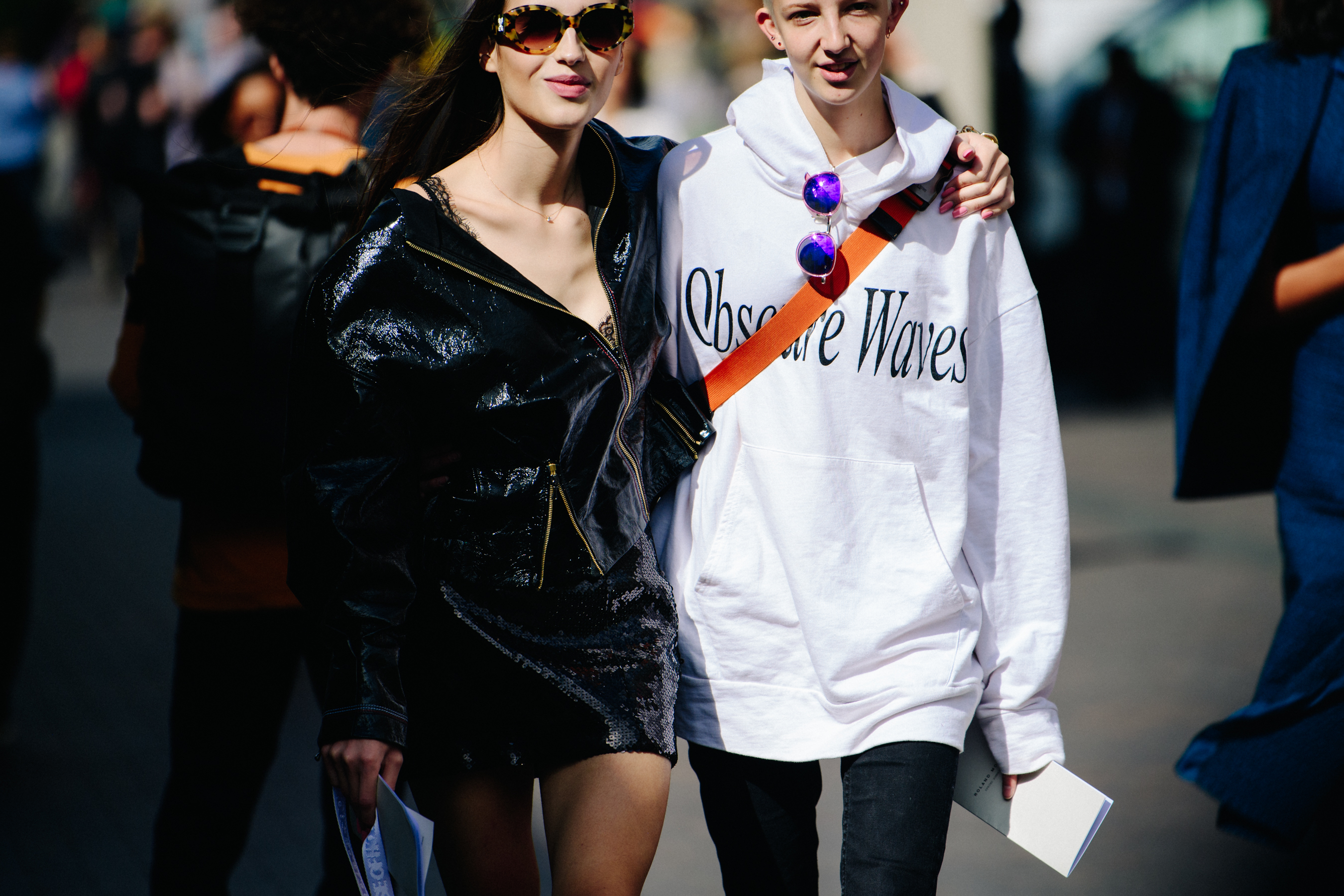 Two models wearing white and black