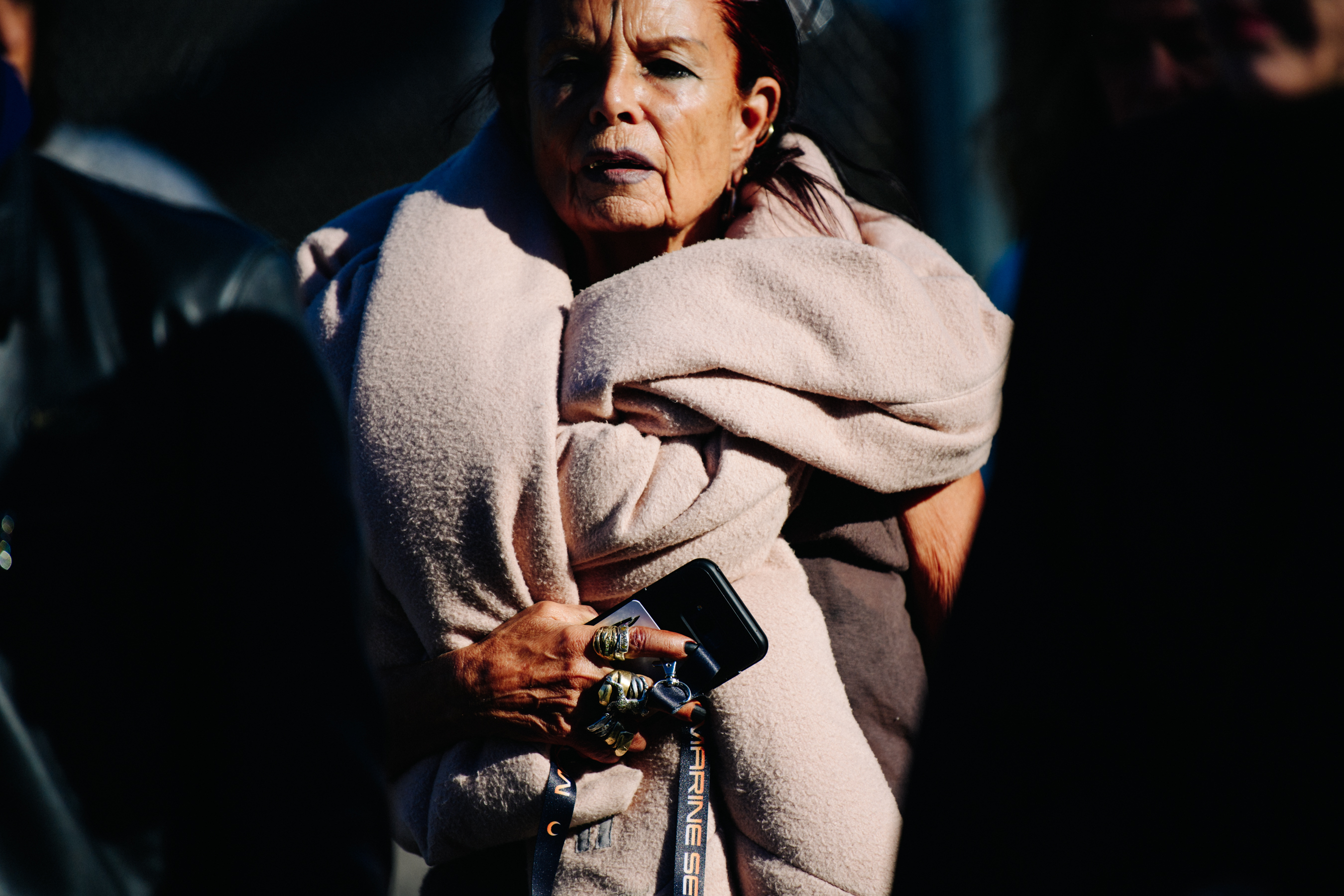 Designer wearing large scarf