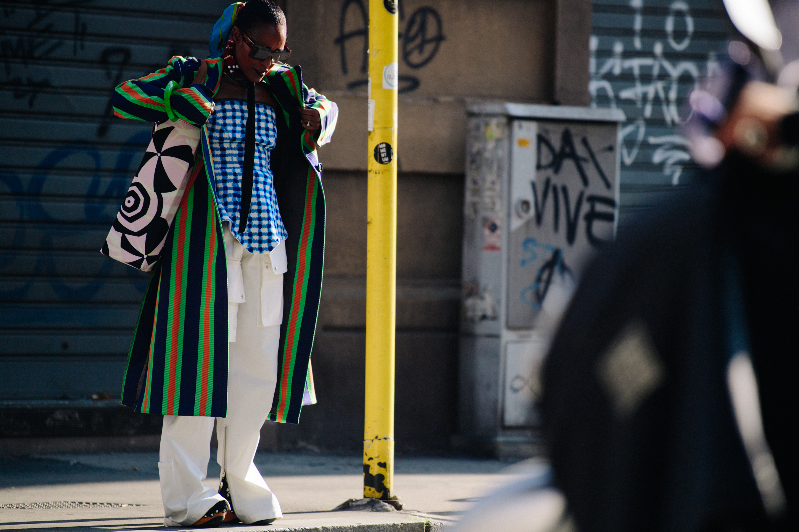 Woman wearing striped coat
