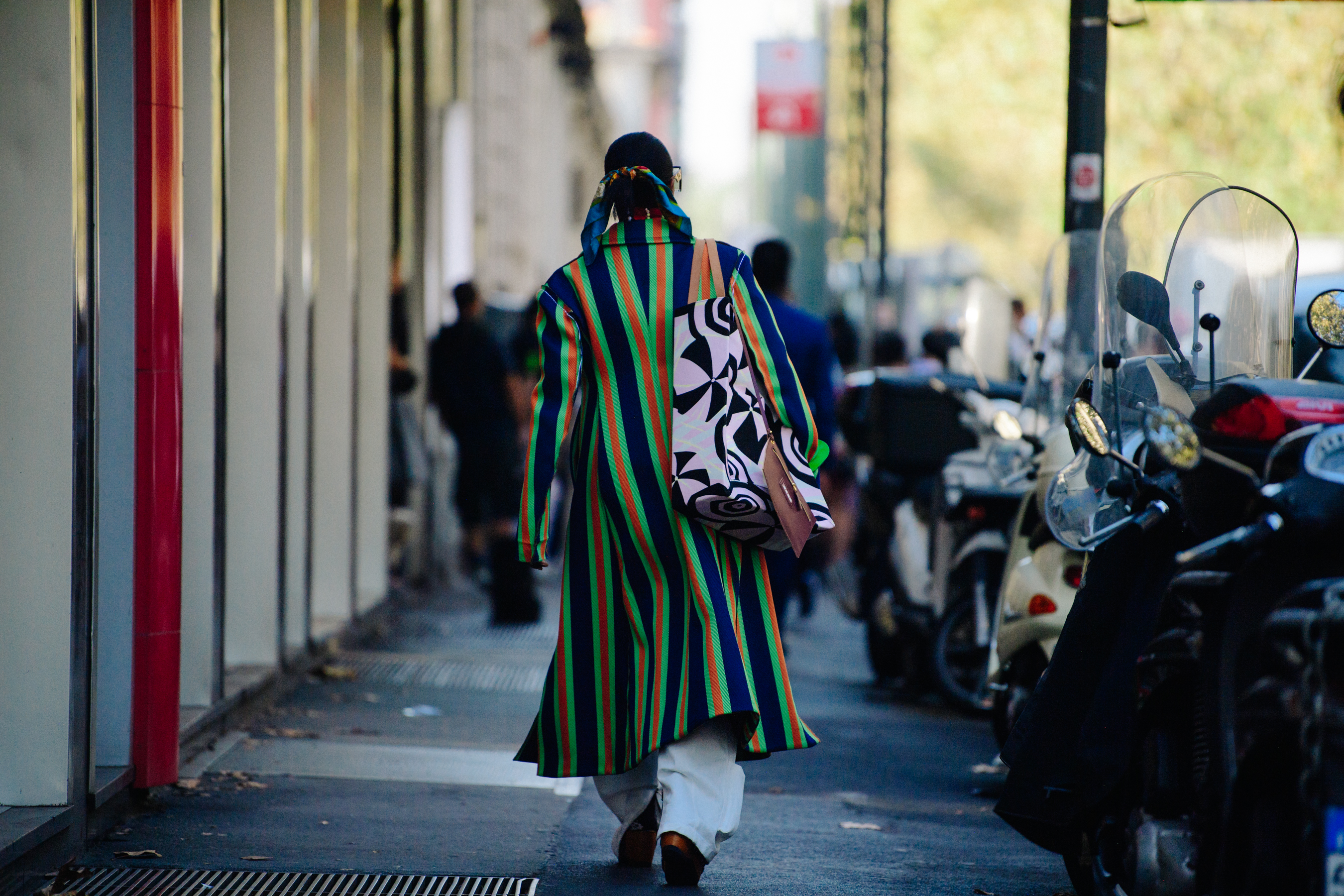 Woman wearing striped coat