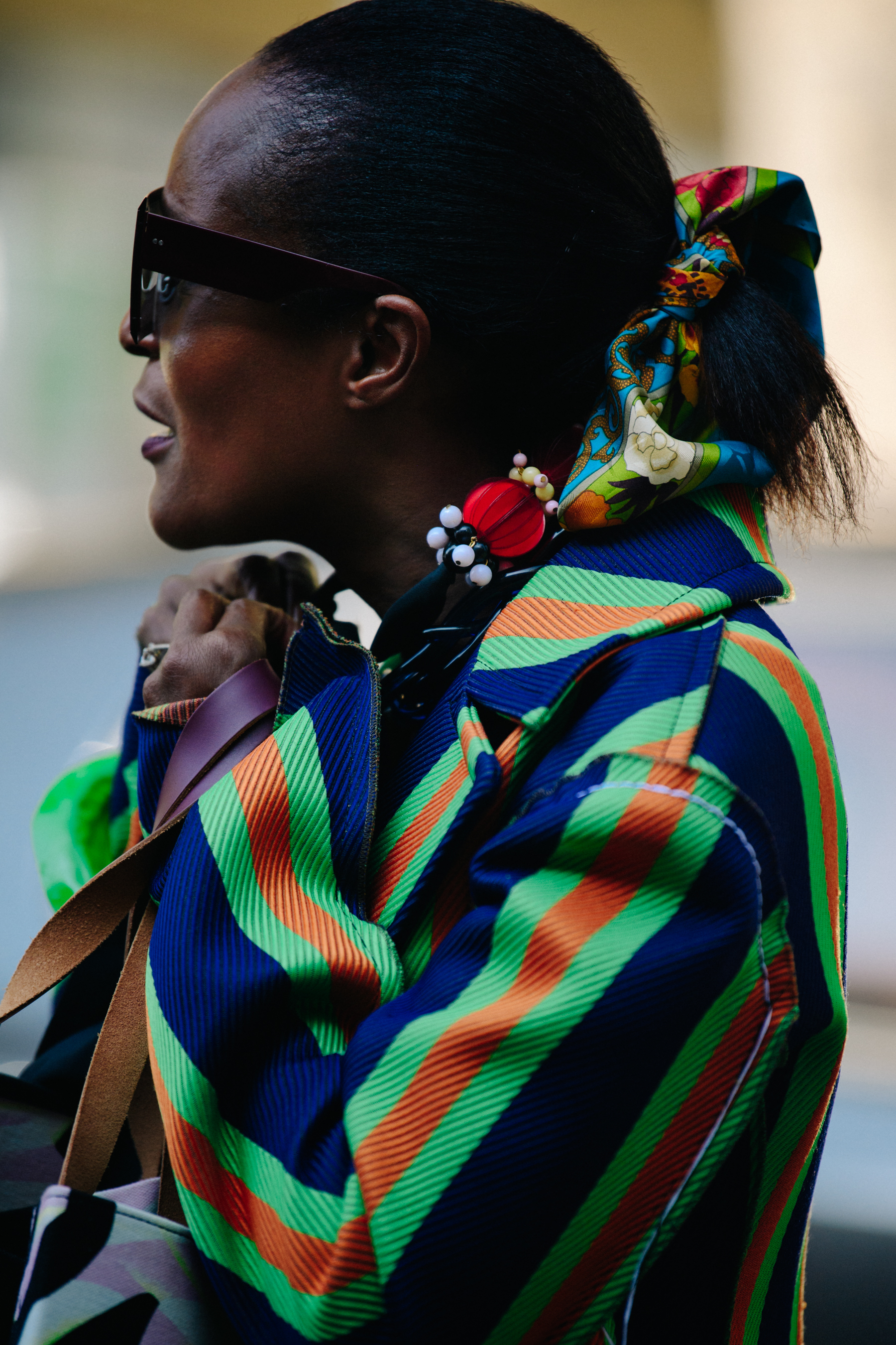 Woman wearing striped coat