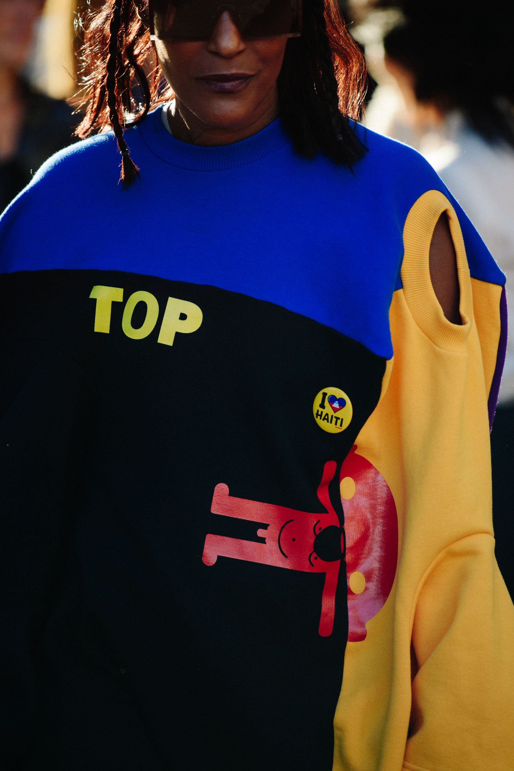 Woman wearing colourful jumper