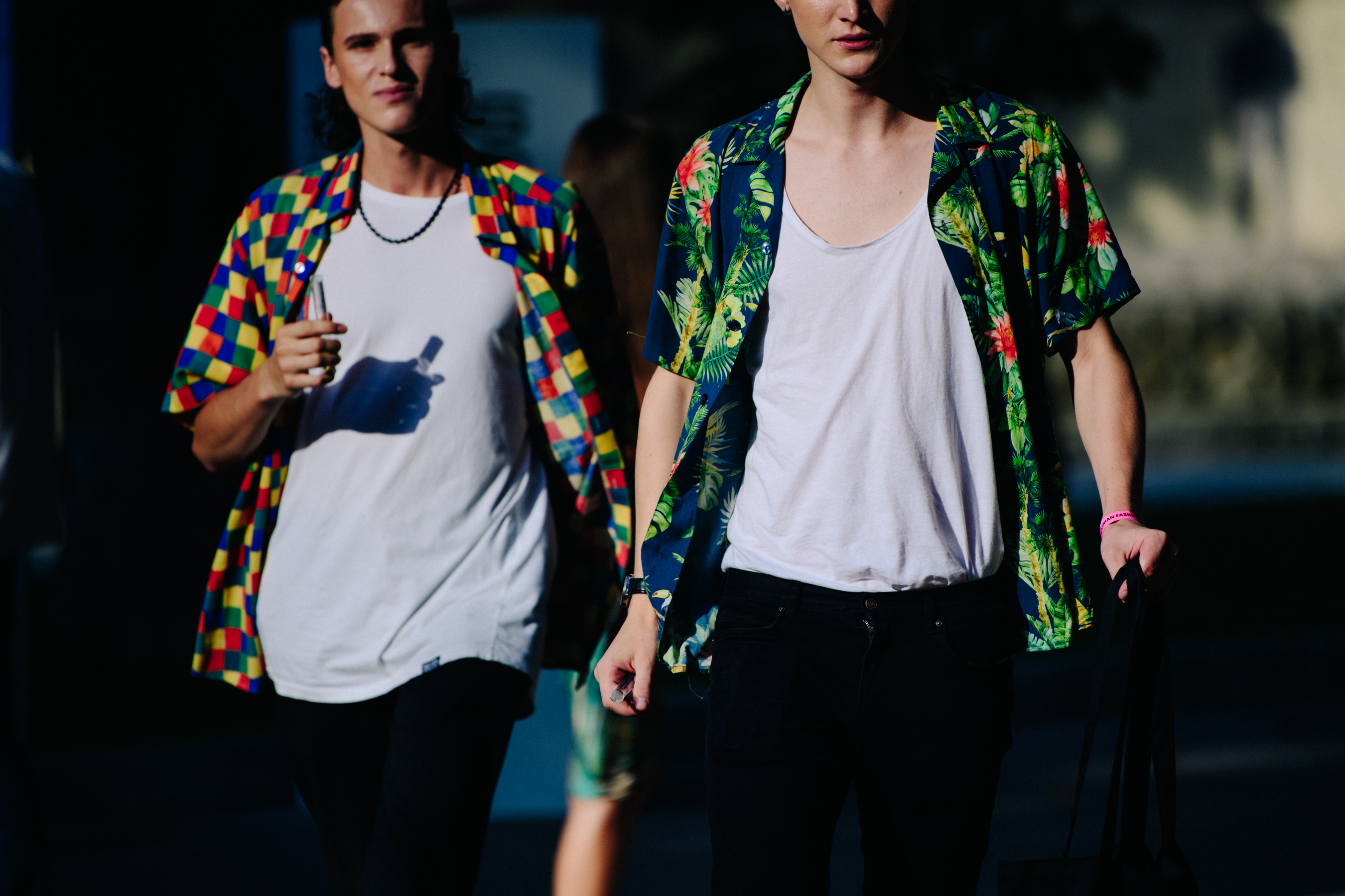 Two men wearing colourful shirts