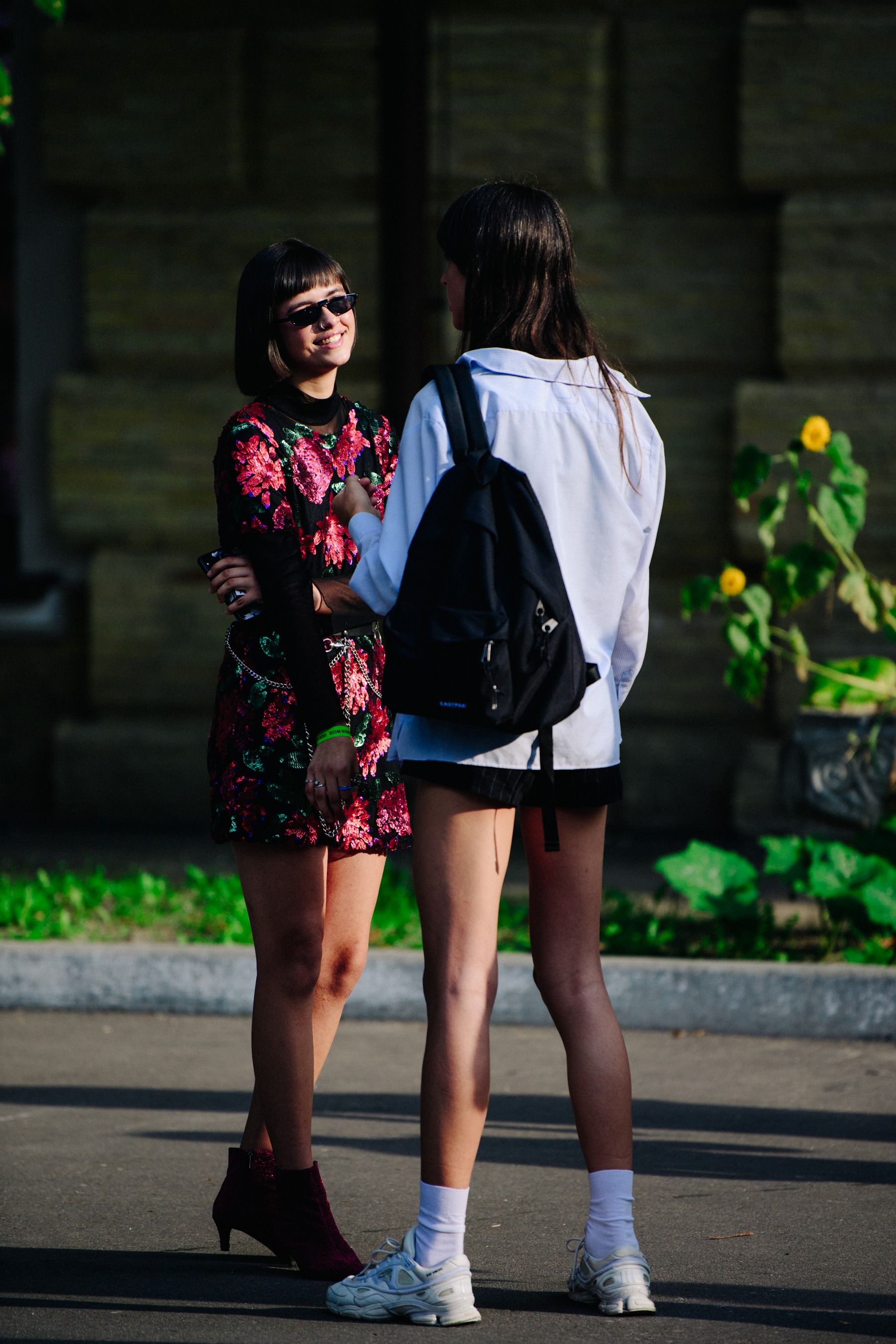 Two women wearing short skirts