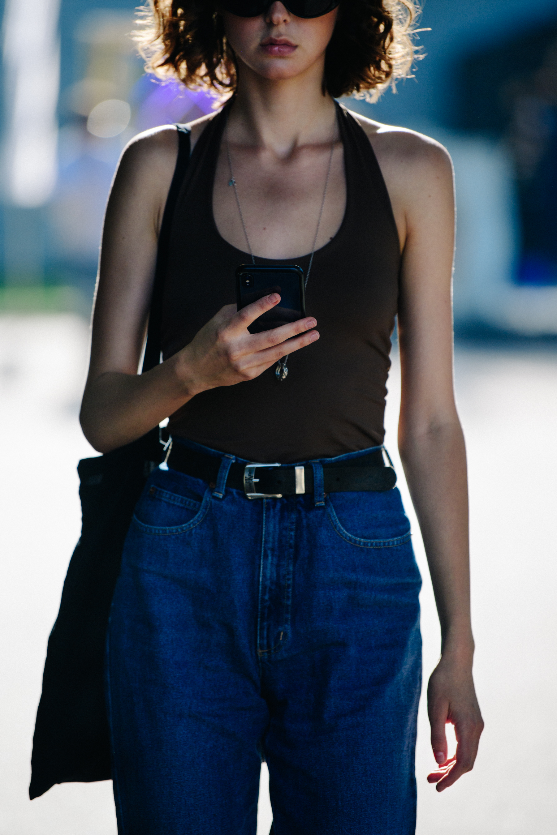 Woman wearing brown tank top