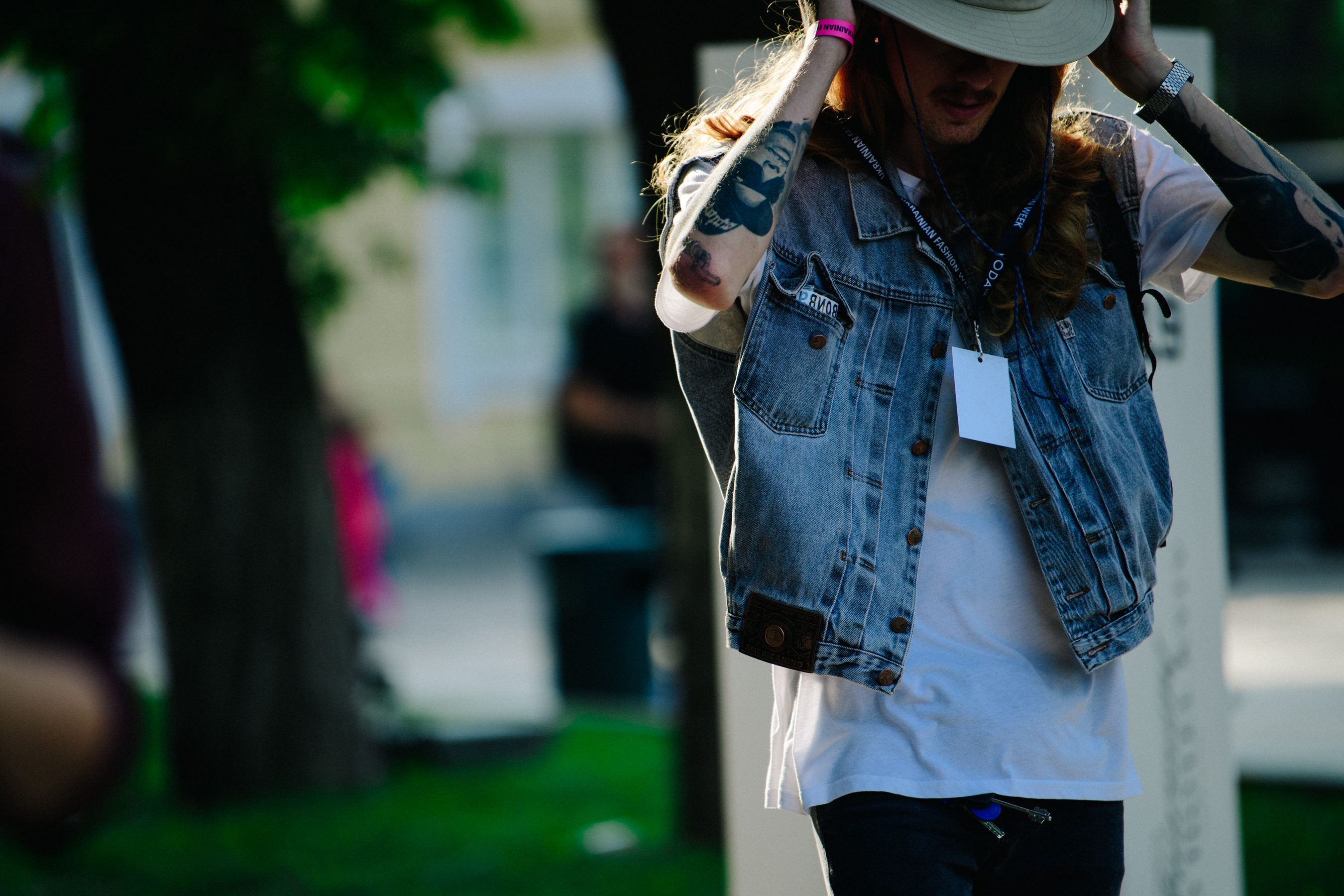 Man wearing denim vest
