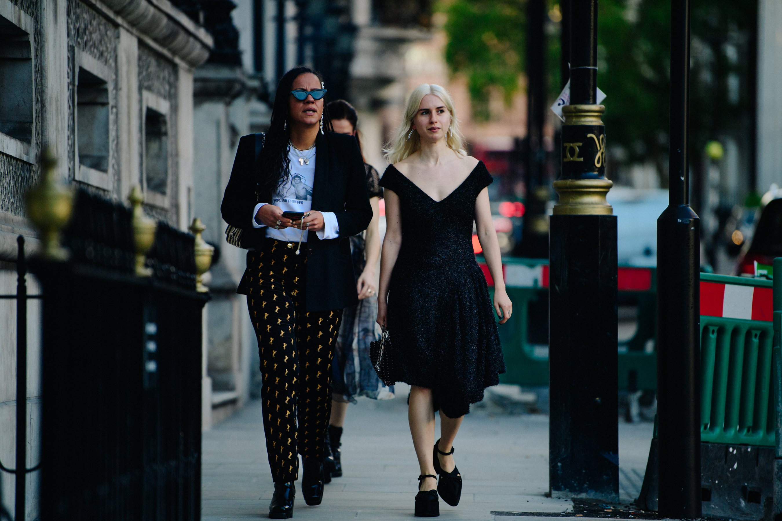 Two women wearing black