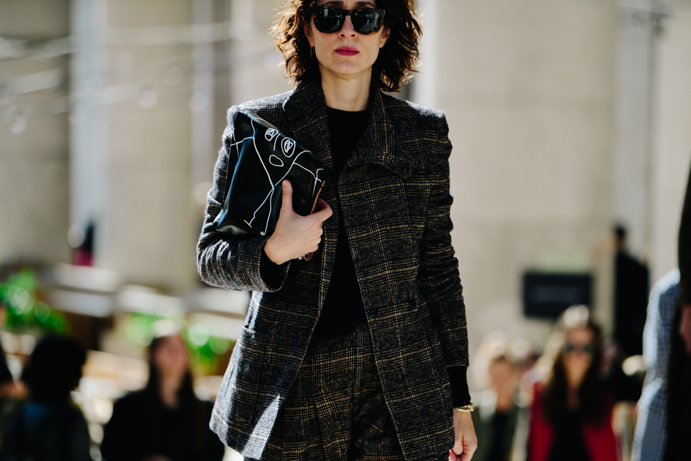 Woman wearing check coat