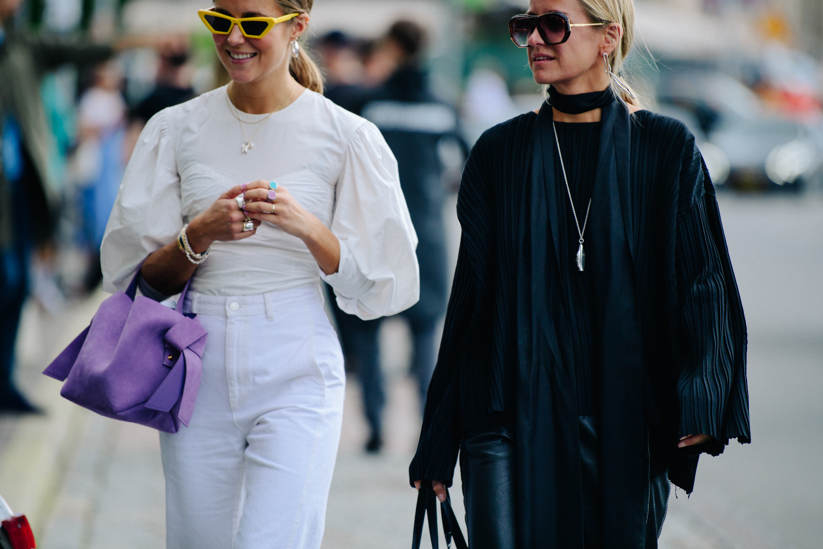 Two women wearing black and white