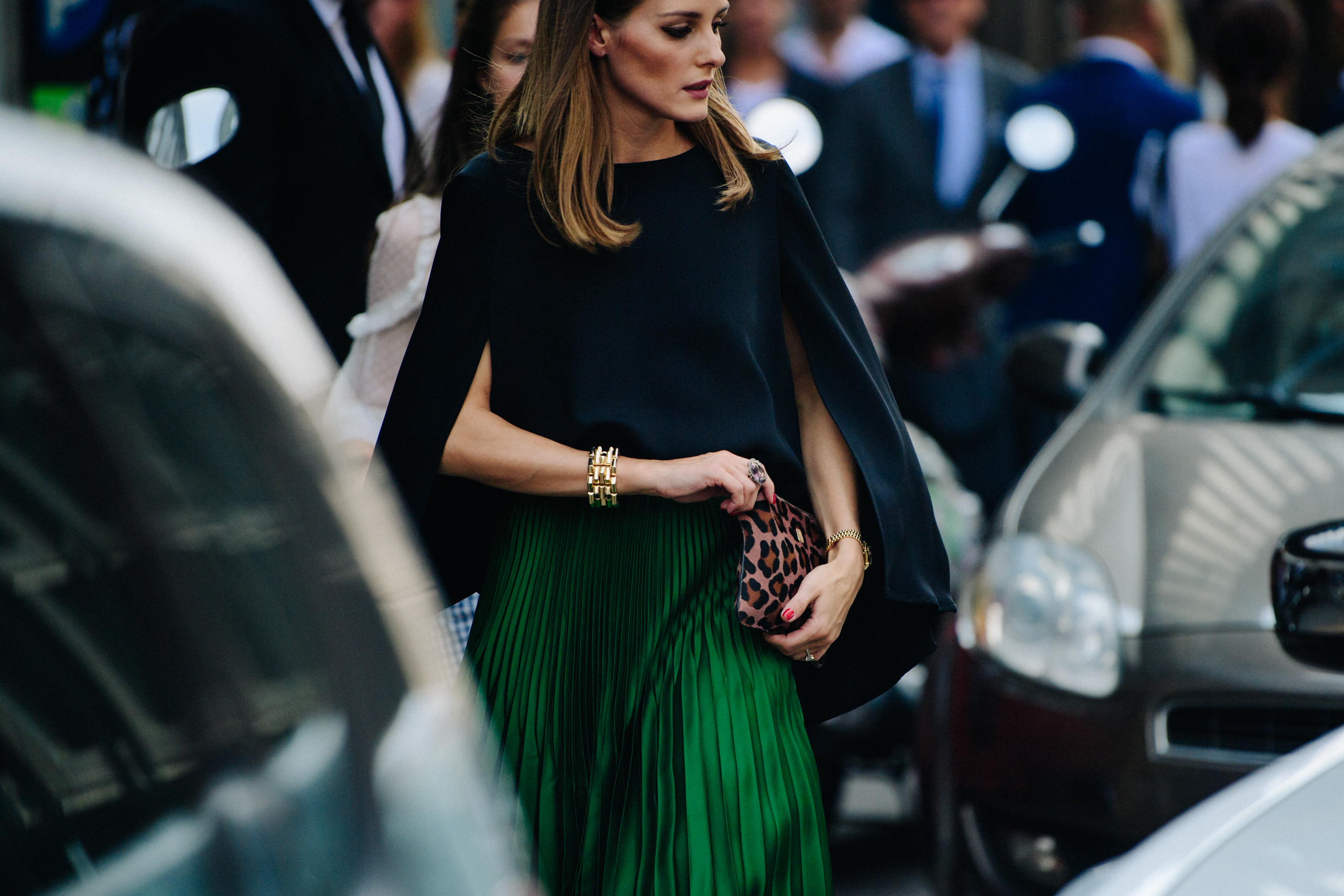 Woman wearing pleated green skirt