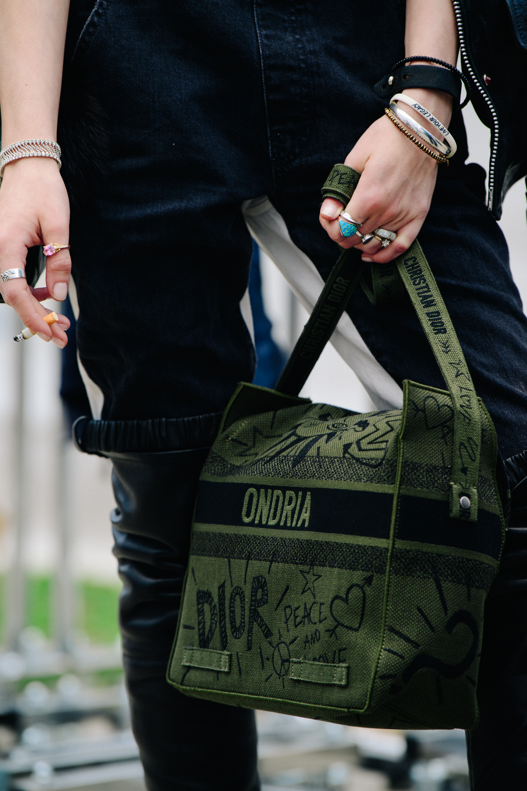Model carrying Christian Dior bag