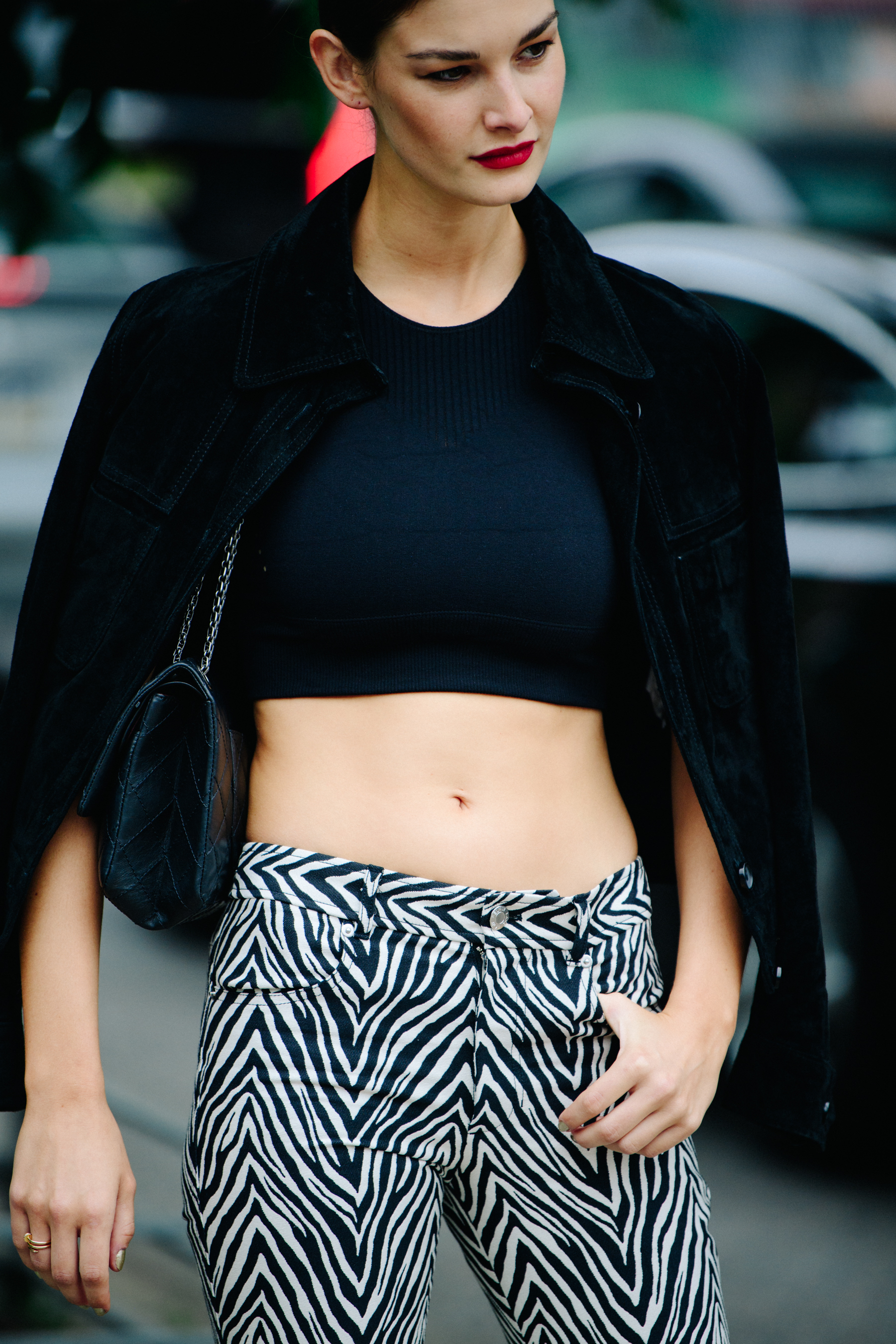 French model wearing black crop top