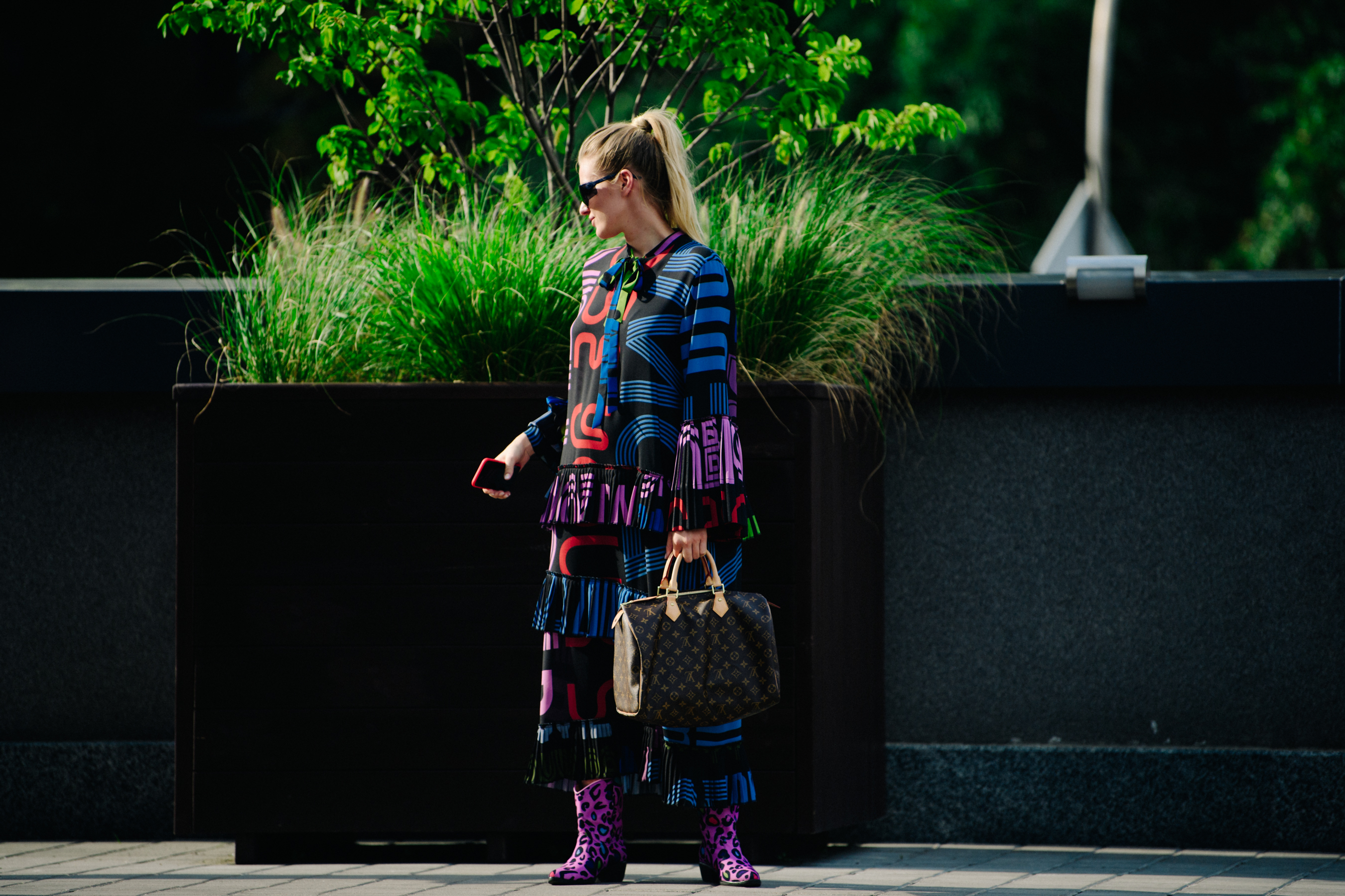 Woman wearing purple boots