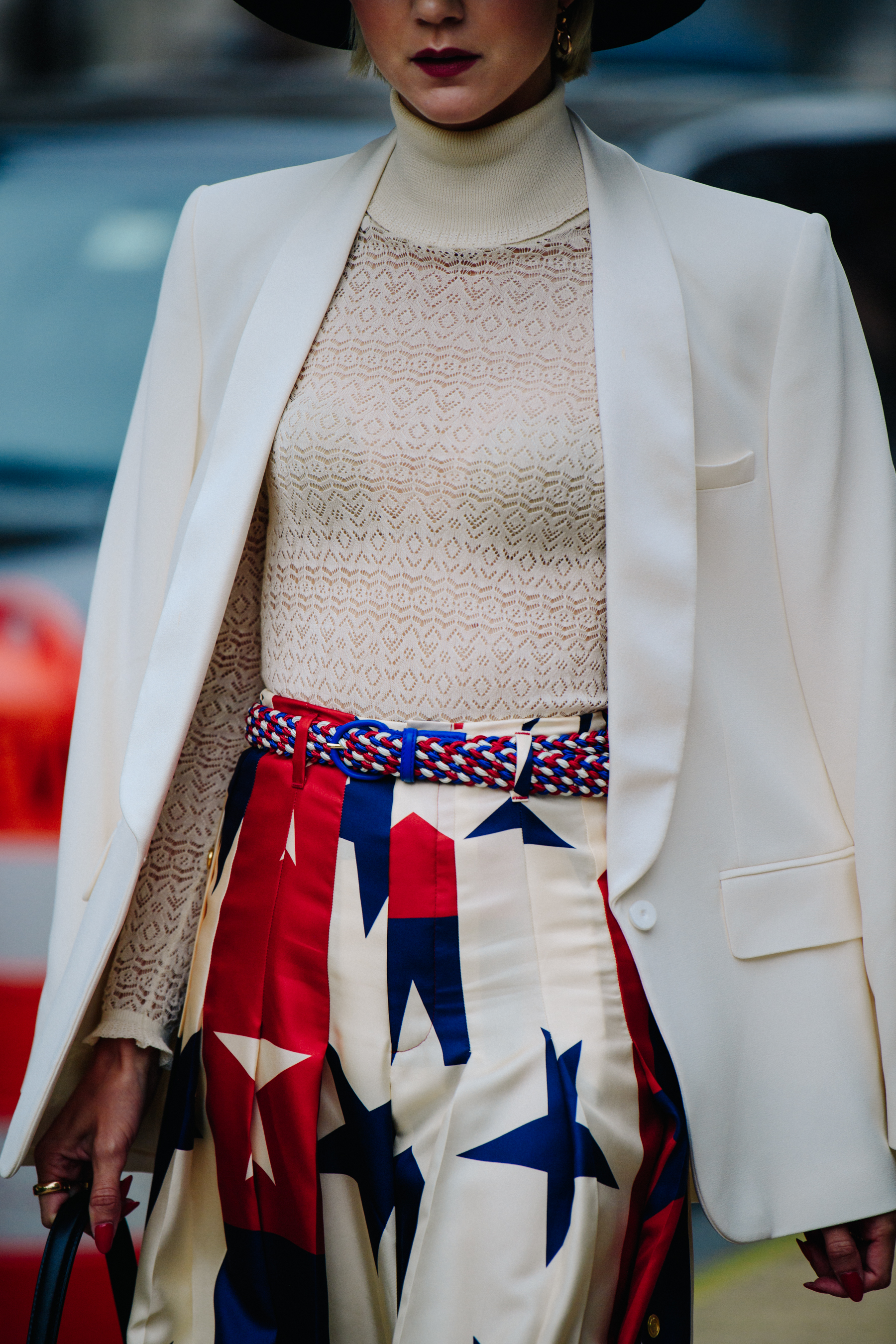 Woman wearing white suit jacket