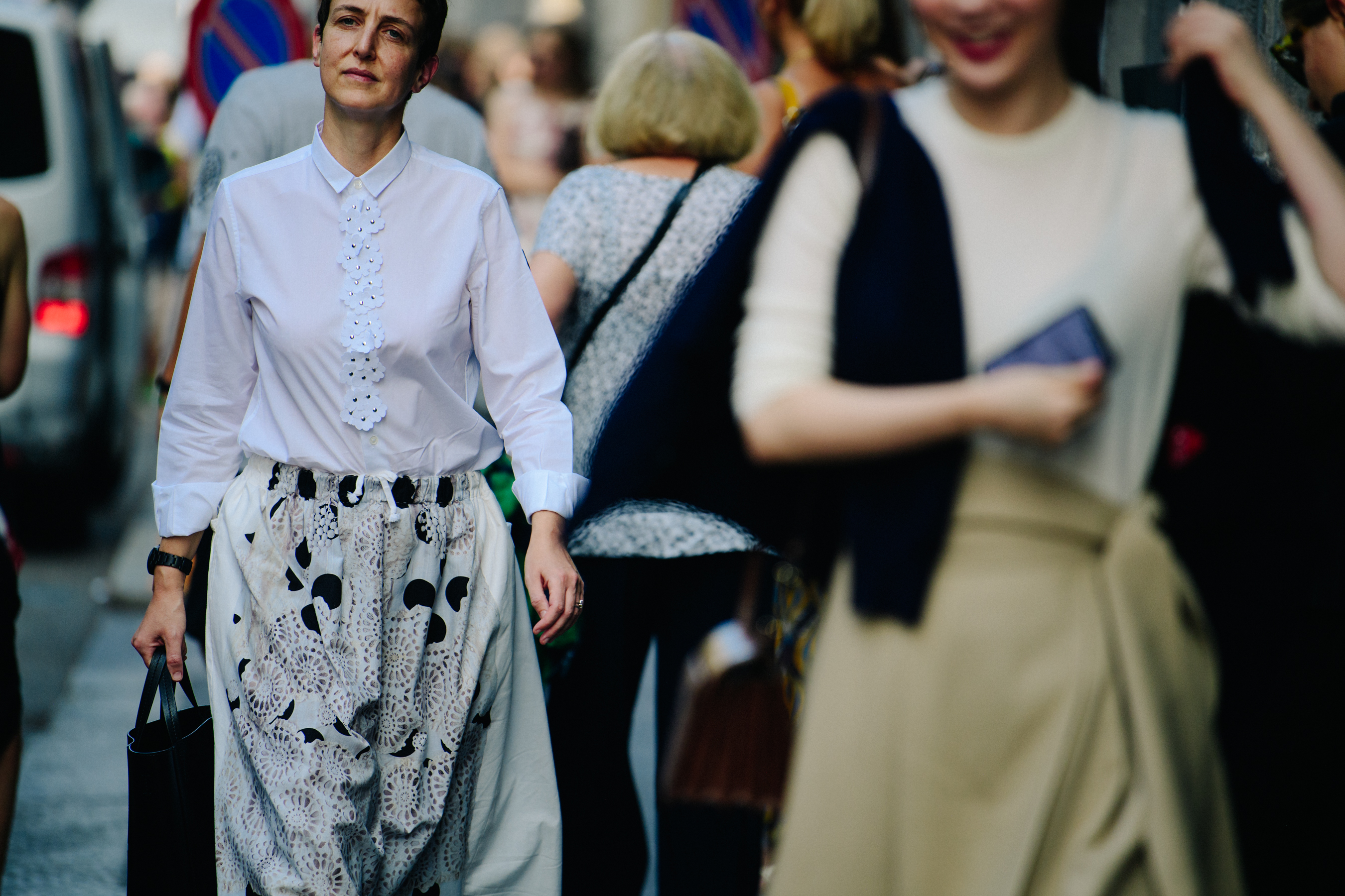 Woman wearing white floral shirt