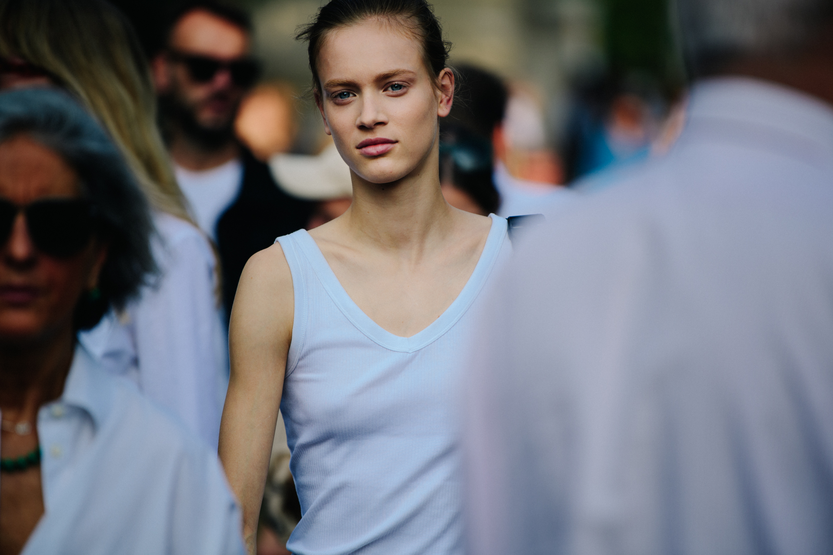 Model wearing white vest