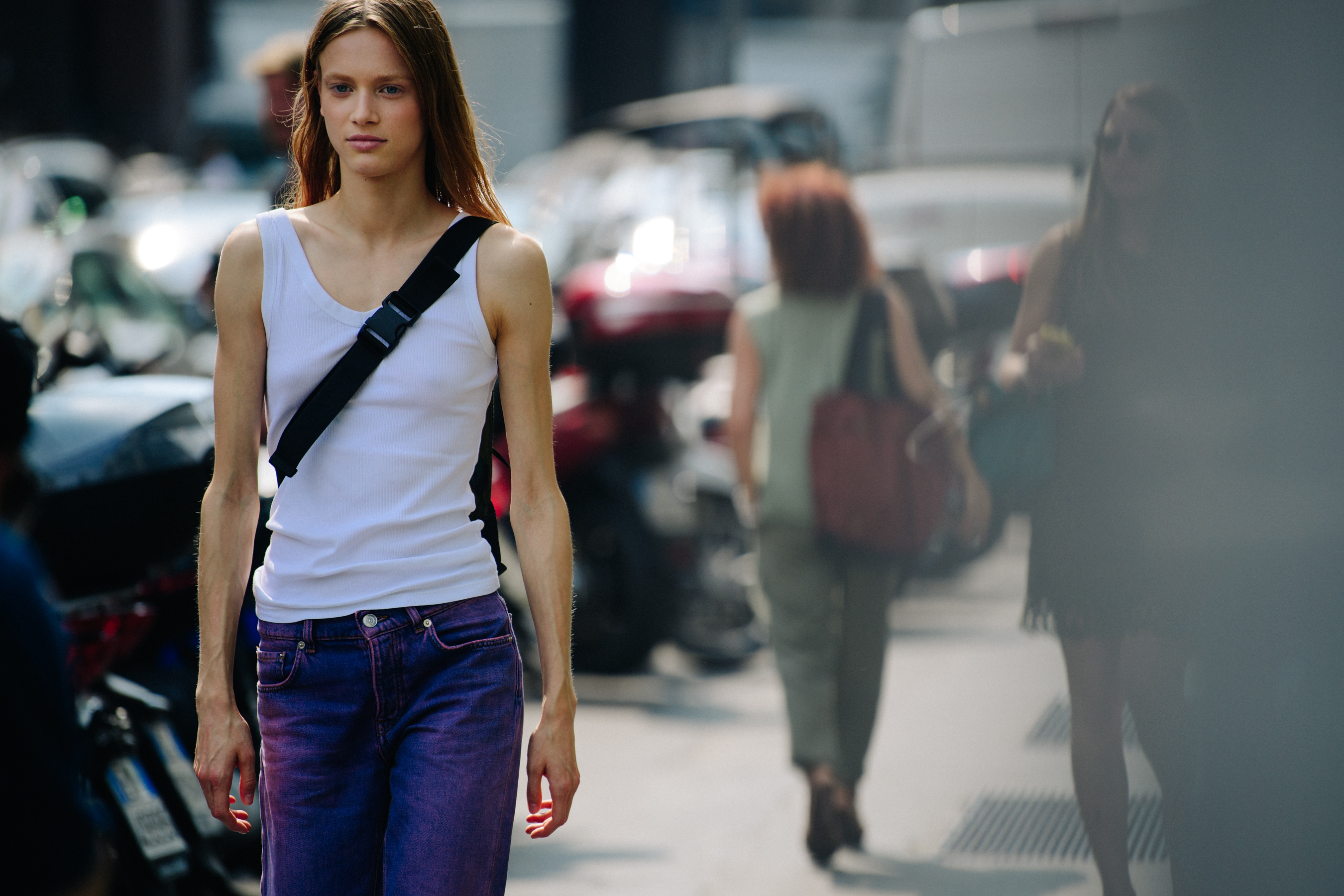 Model wearing white tank top