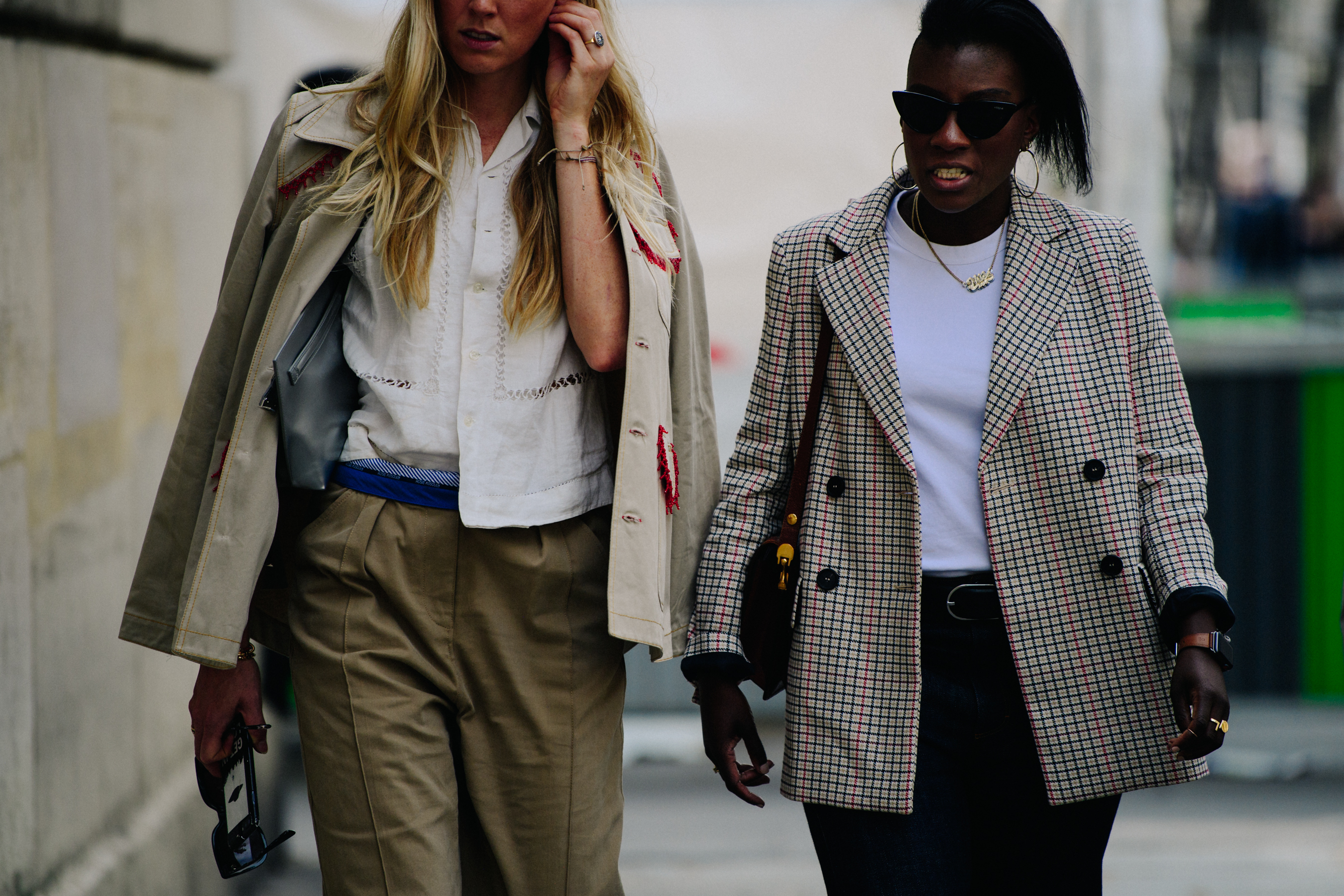 Two women wearing light jackets