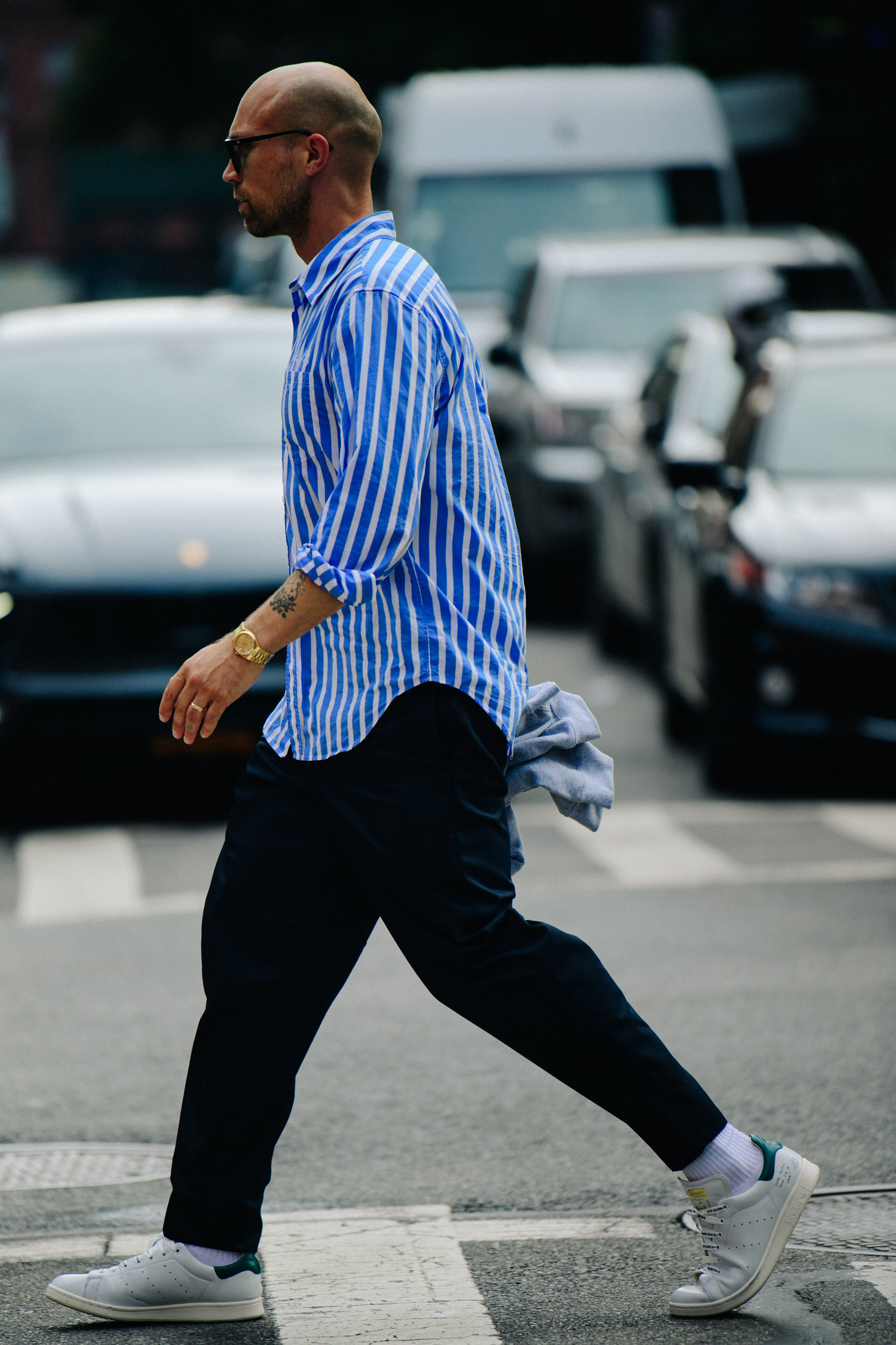Man wearing striped blue shirt