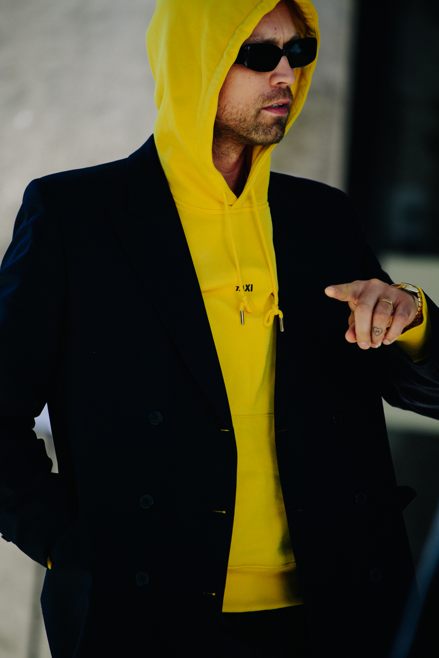Man wearing yellow hoodie