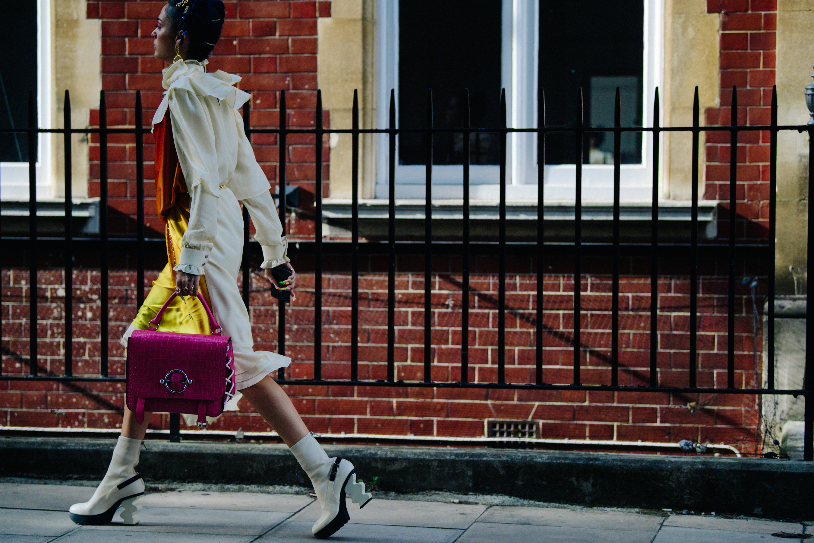 Woman carrying purple bag