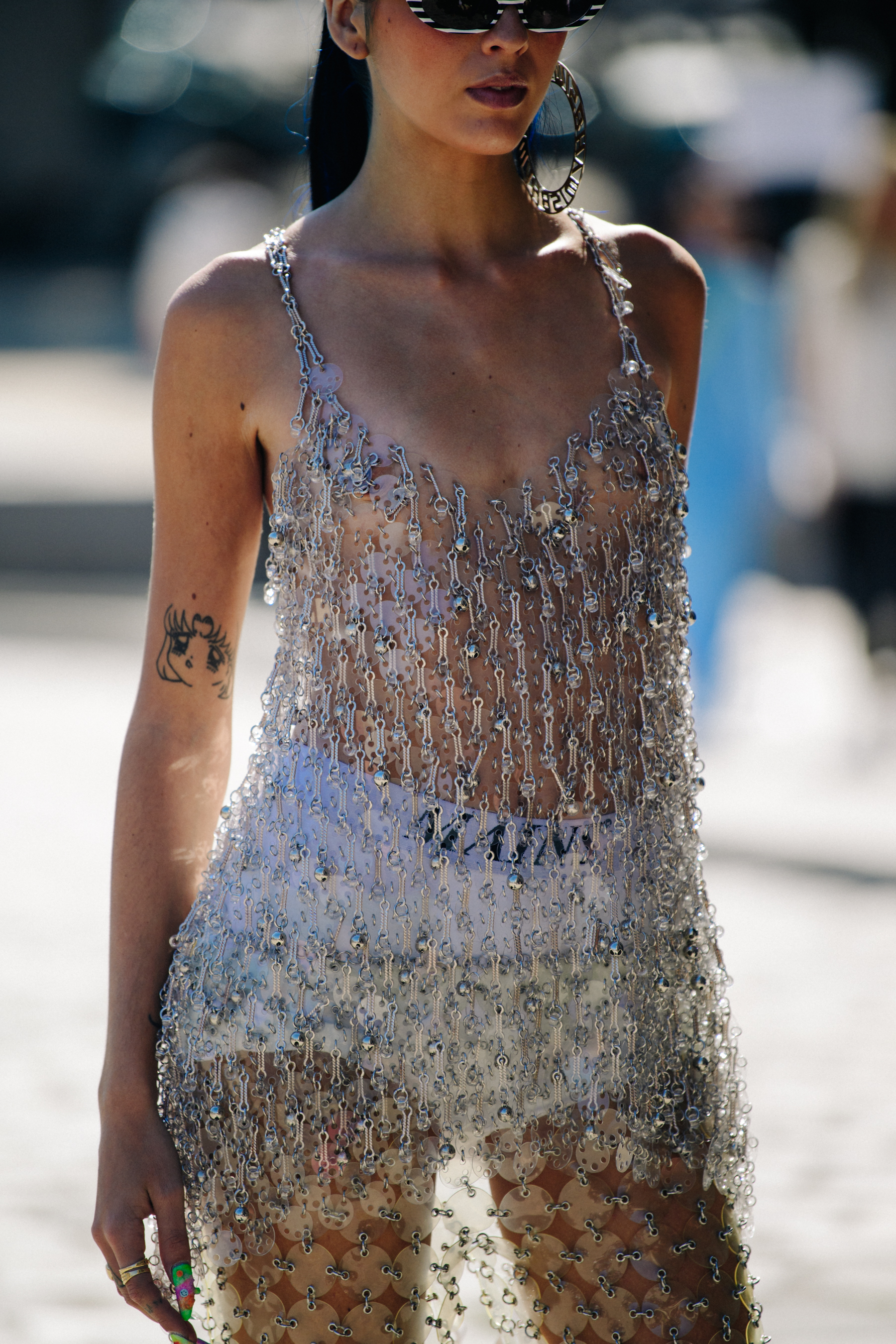Woman wearing silver metal dress