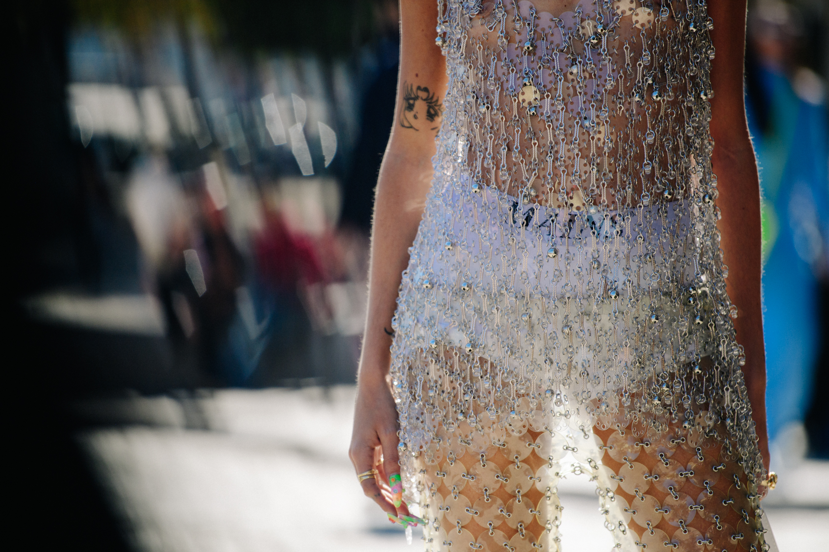 Woman wearing silver metal dress