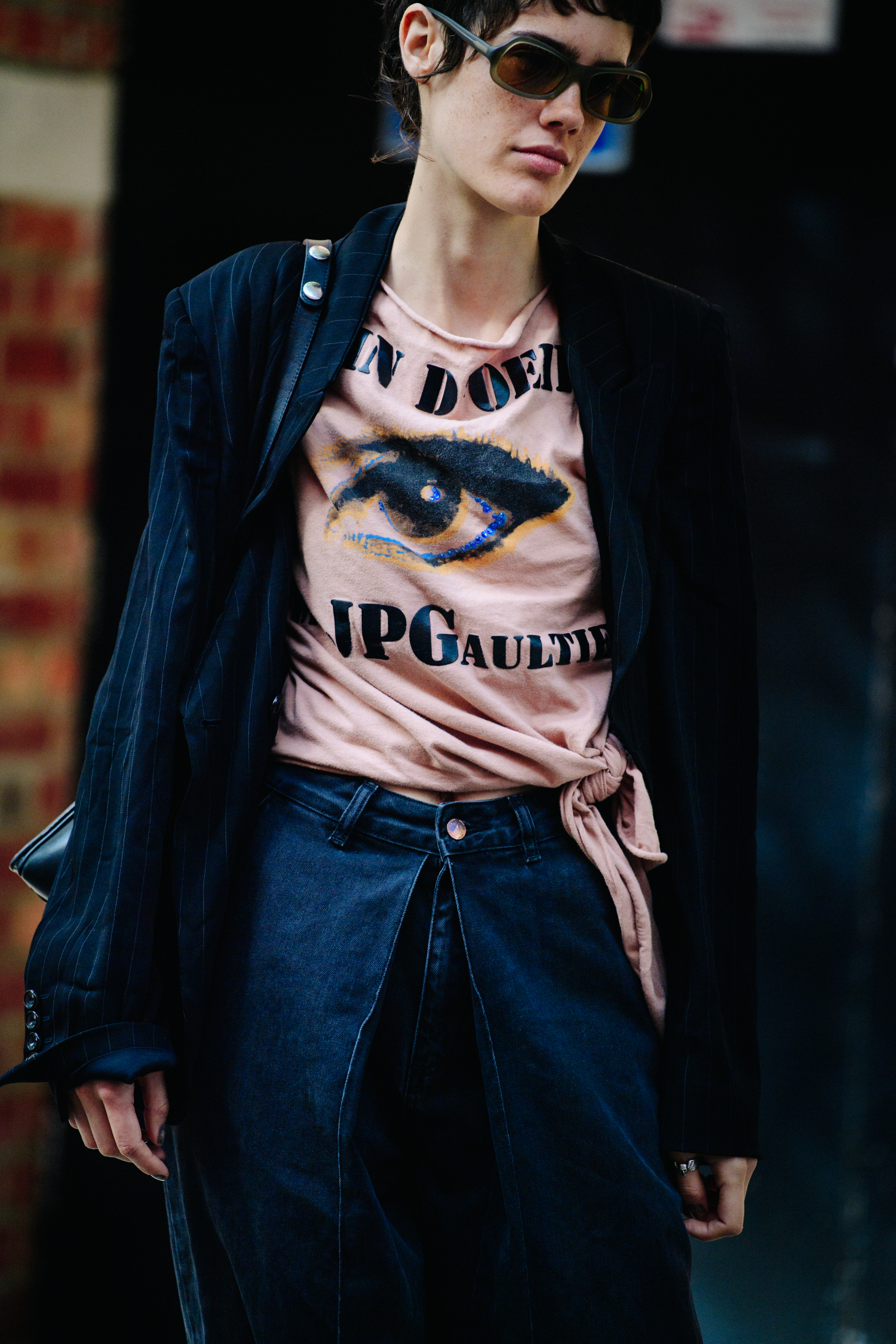 American model wearing pink tee shirt