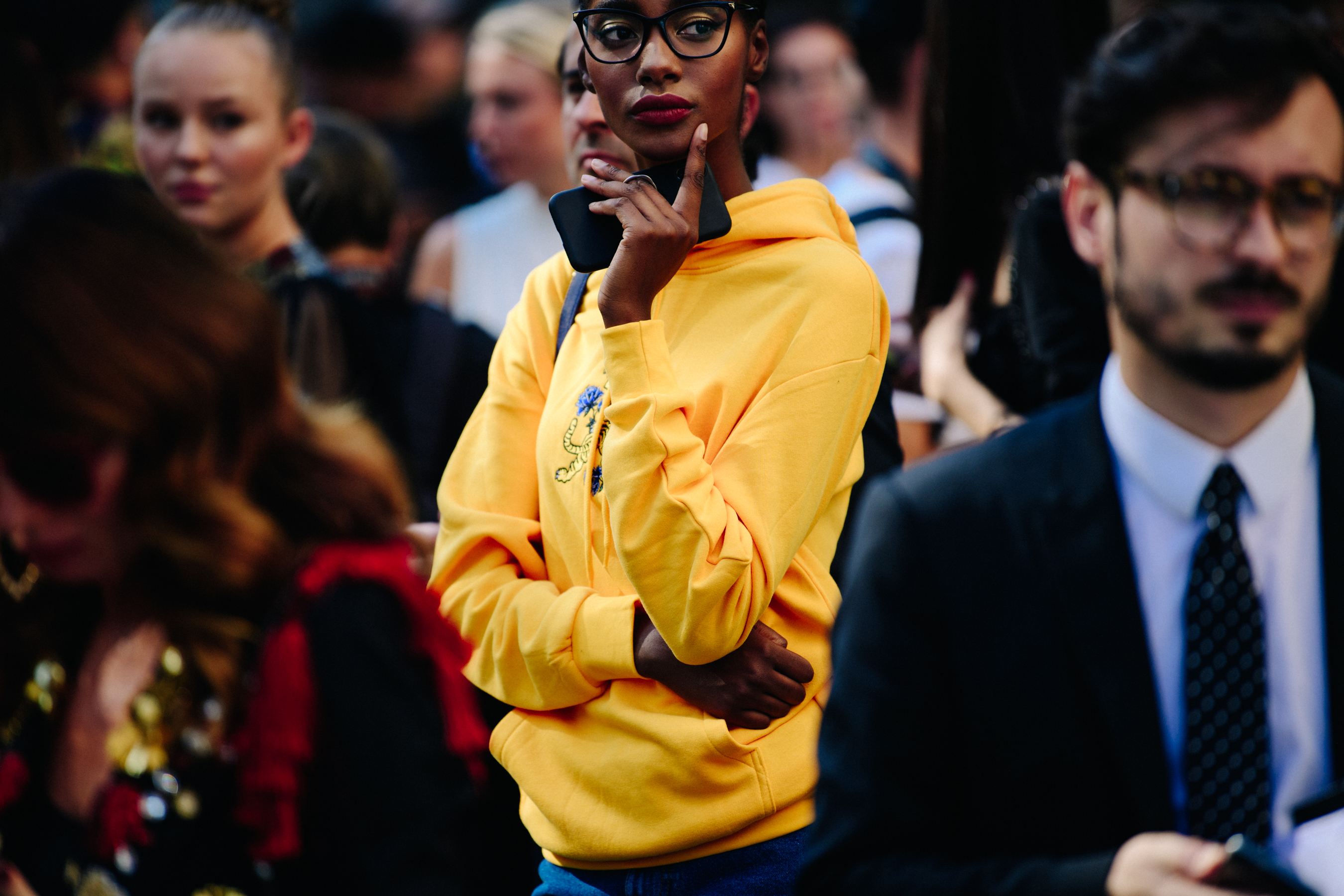 Model wearing yellow hoodie