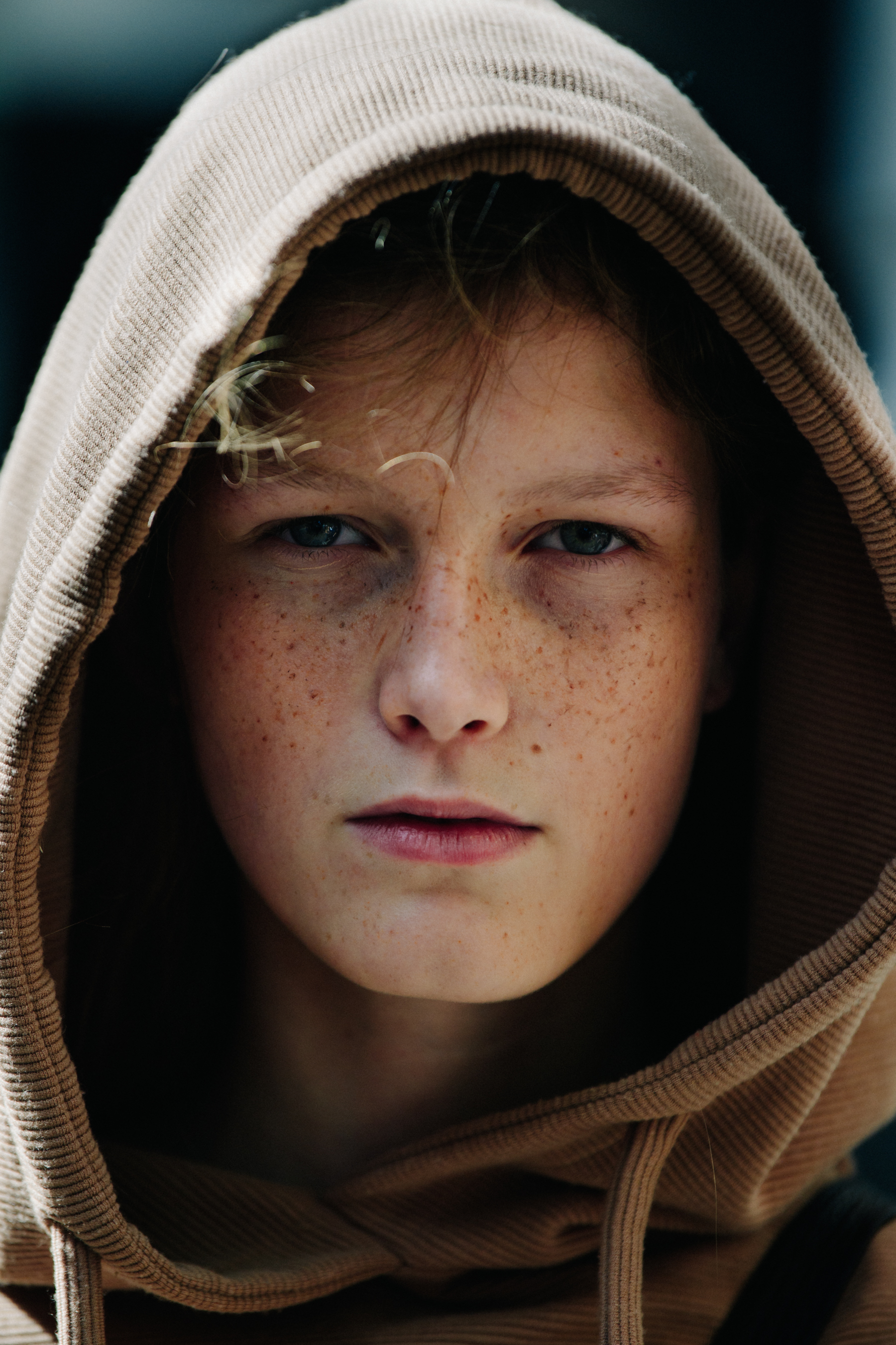 Portrait of model wearing brown hoodie
