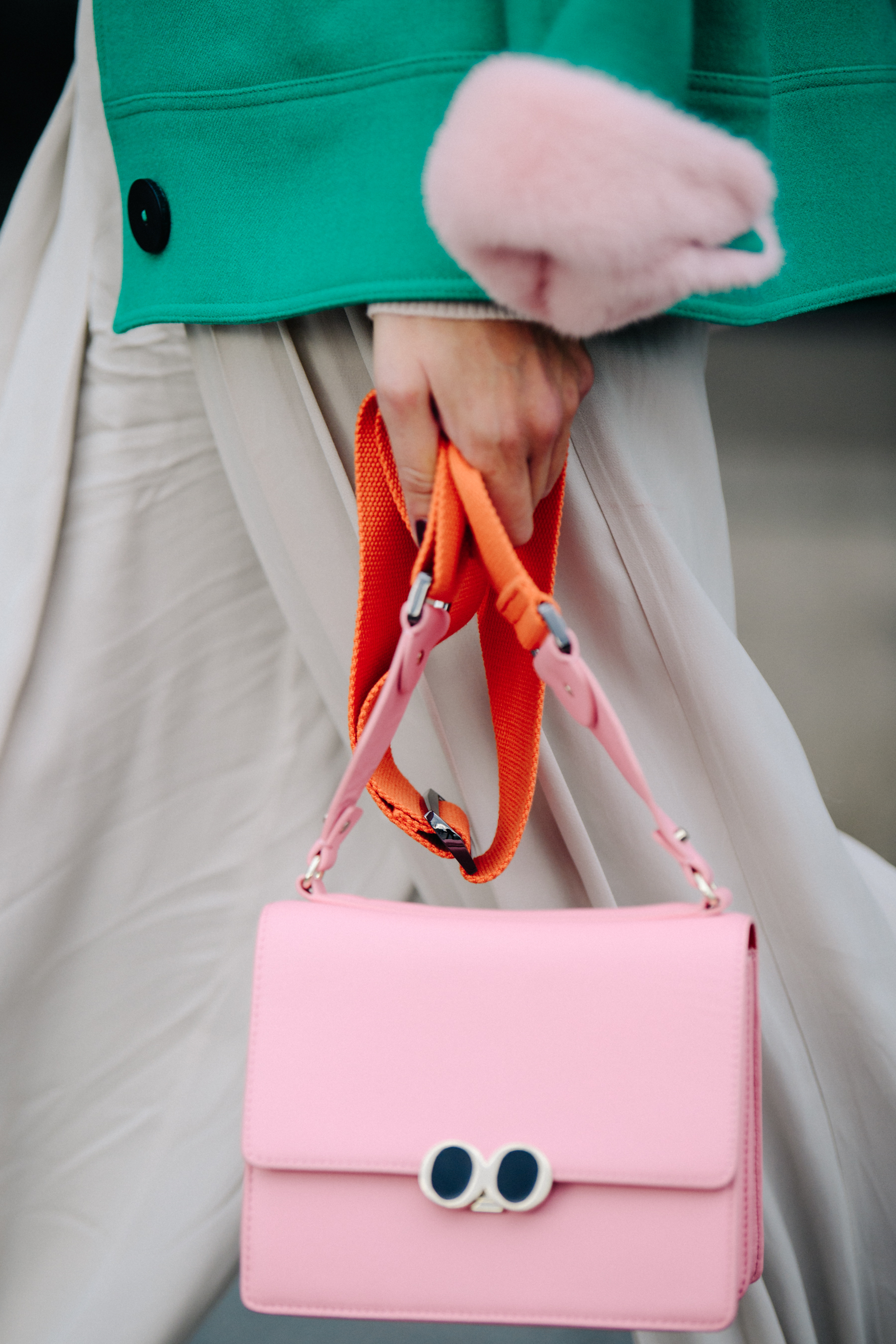 Woman carrying pink bag