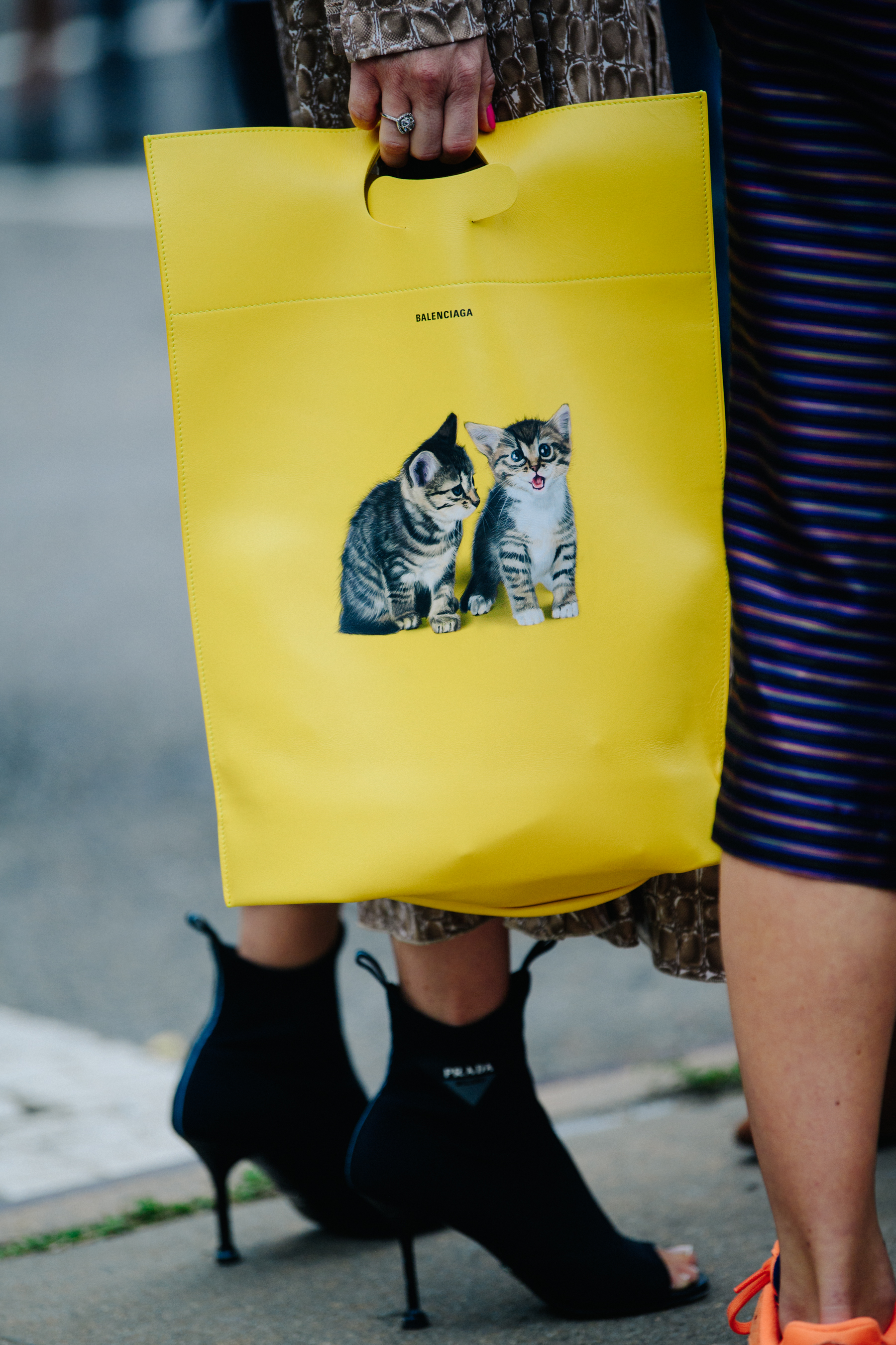 Woman carrying yellow bag