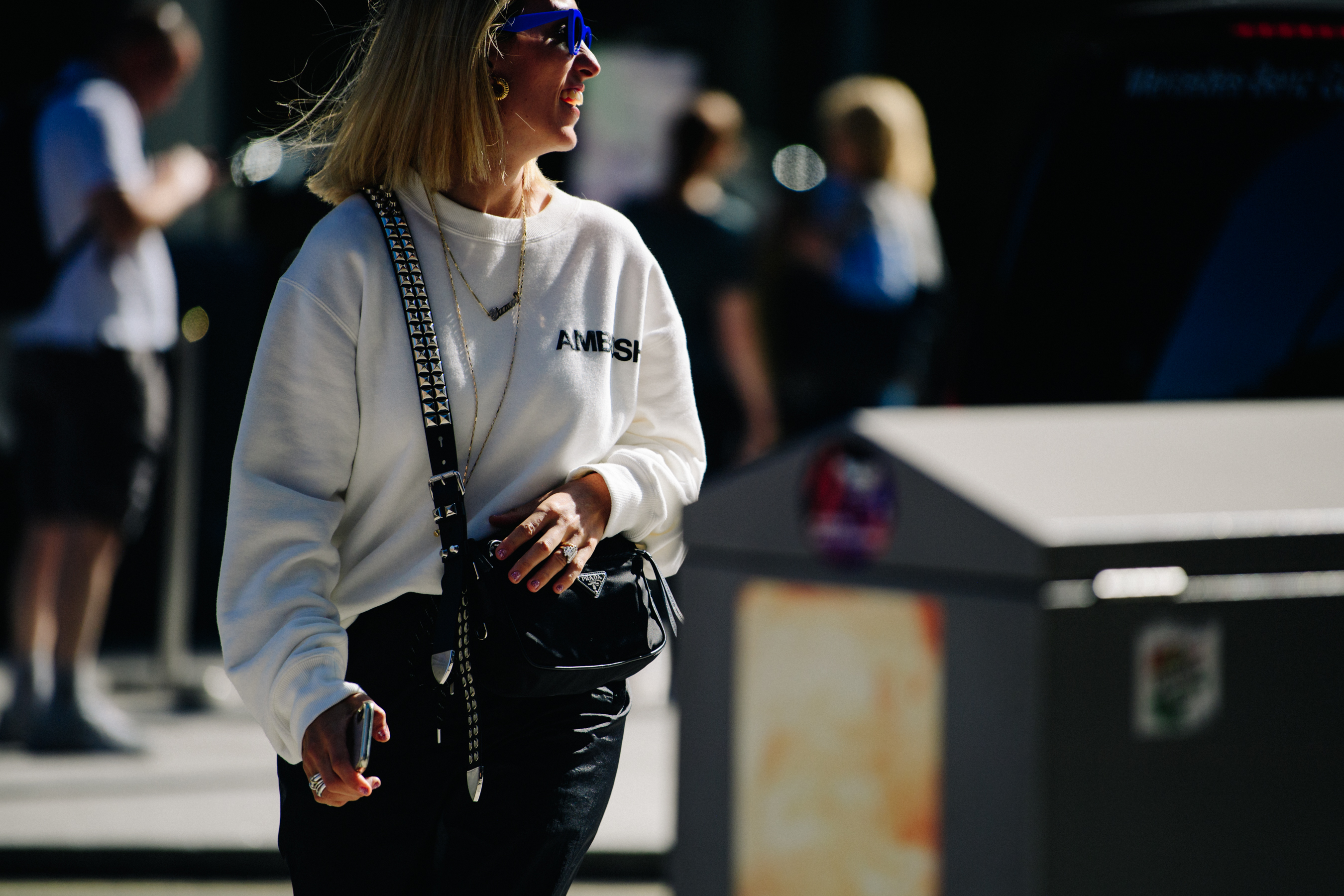 Woman wearing blue sunglasses