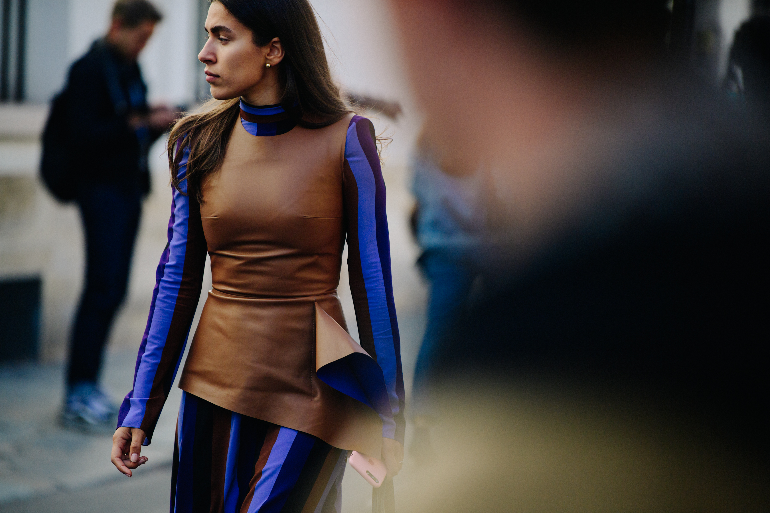 Woman wearing brown leather top