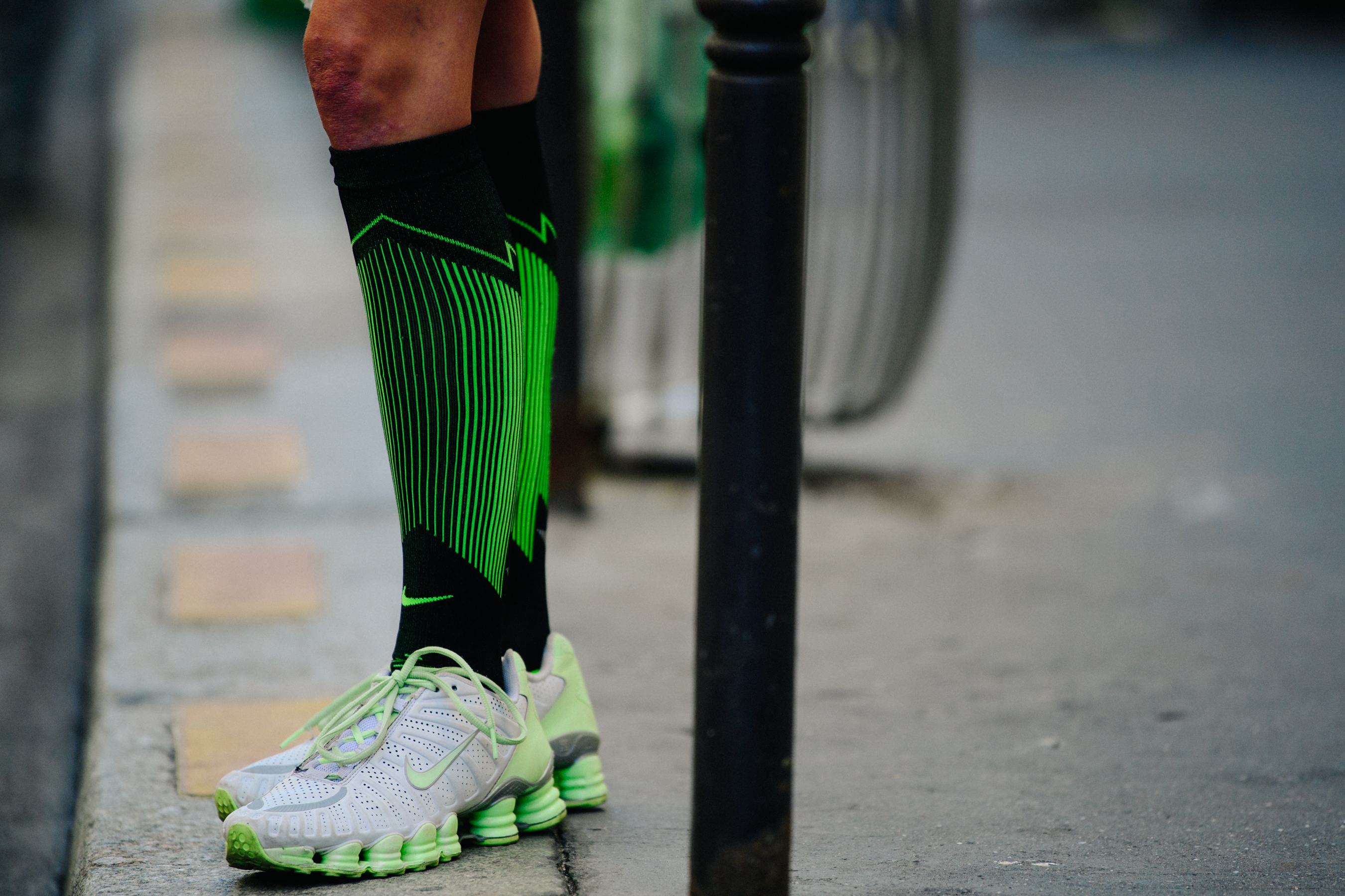 Girl wearing green Nike sneakers and socks