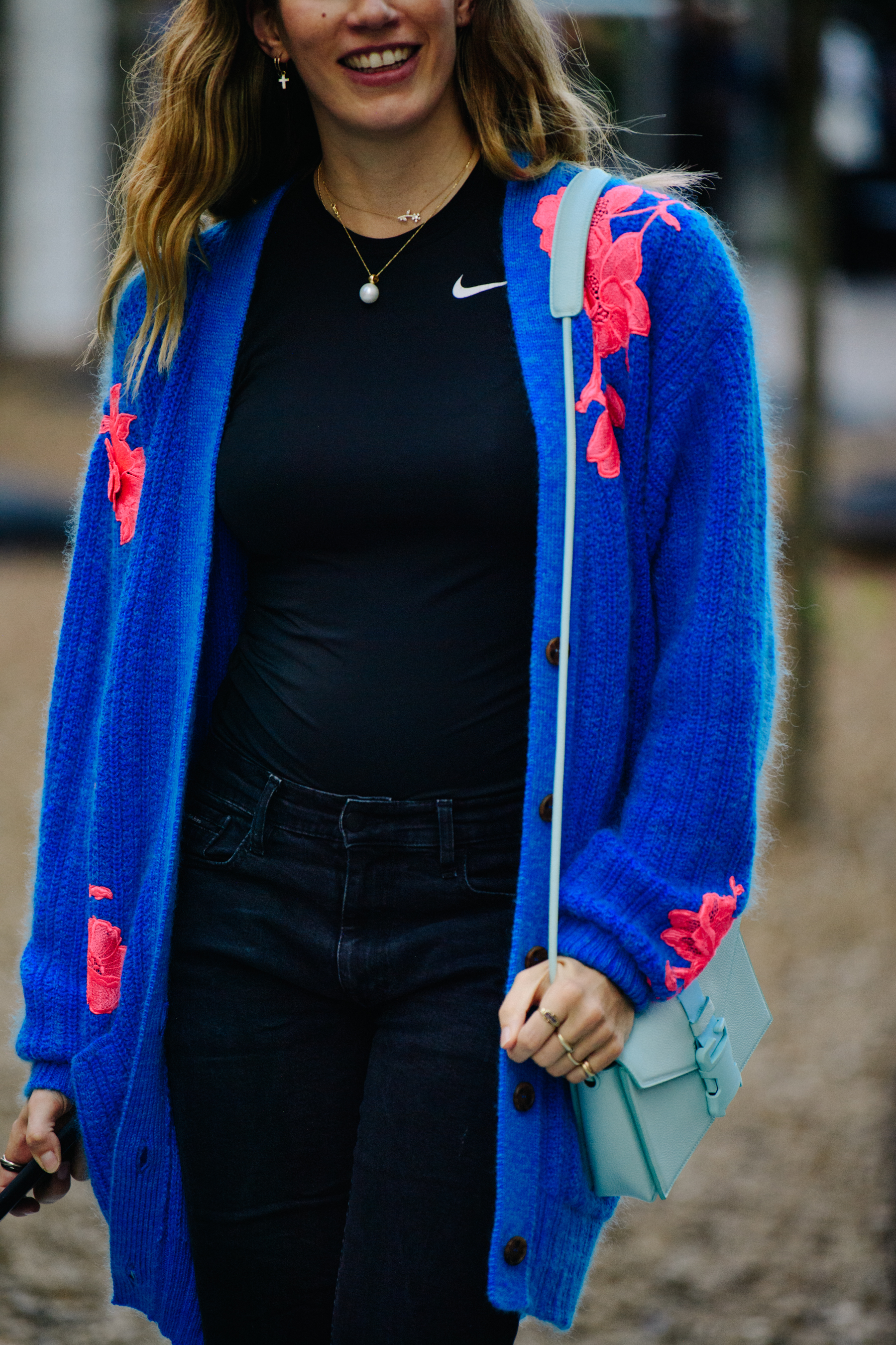 Woman wearing blue cardigan