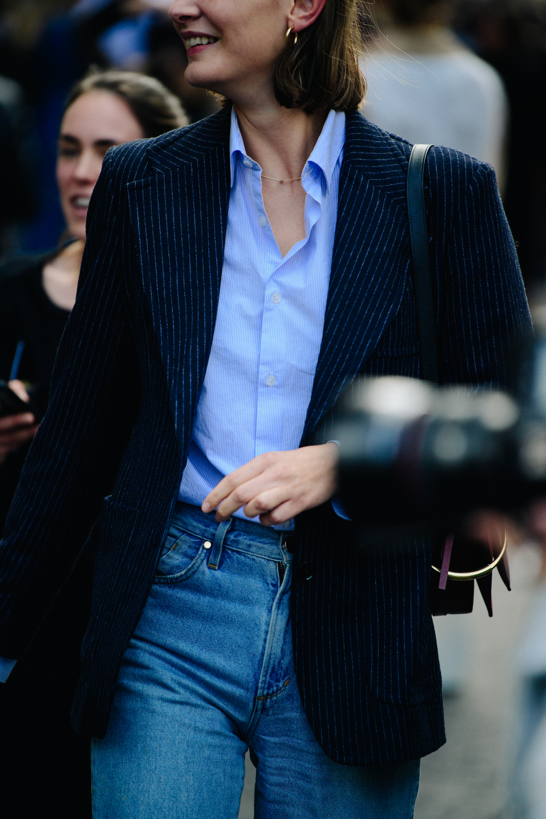Woman wearing blue striped jacket