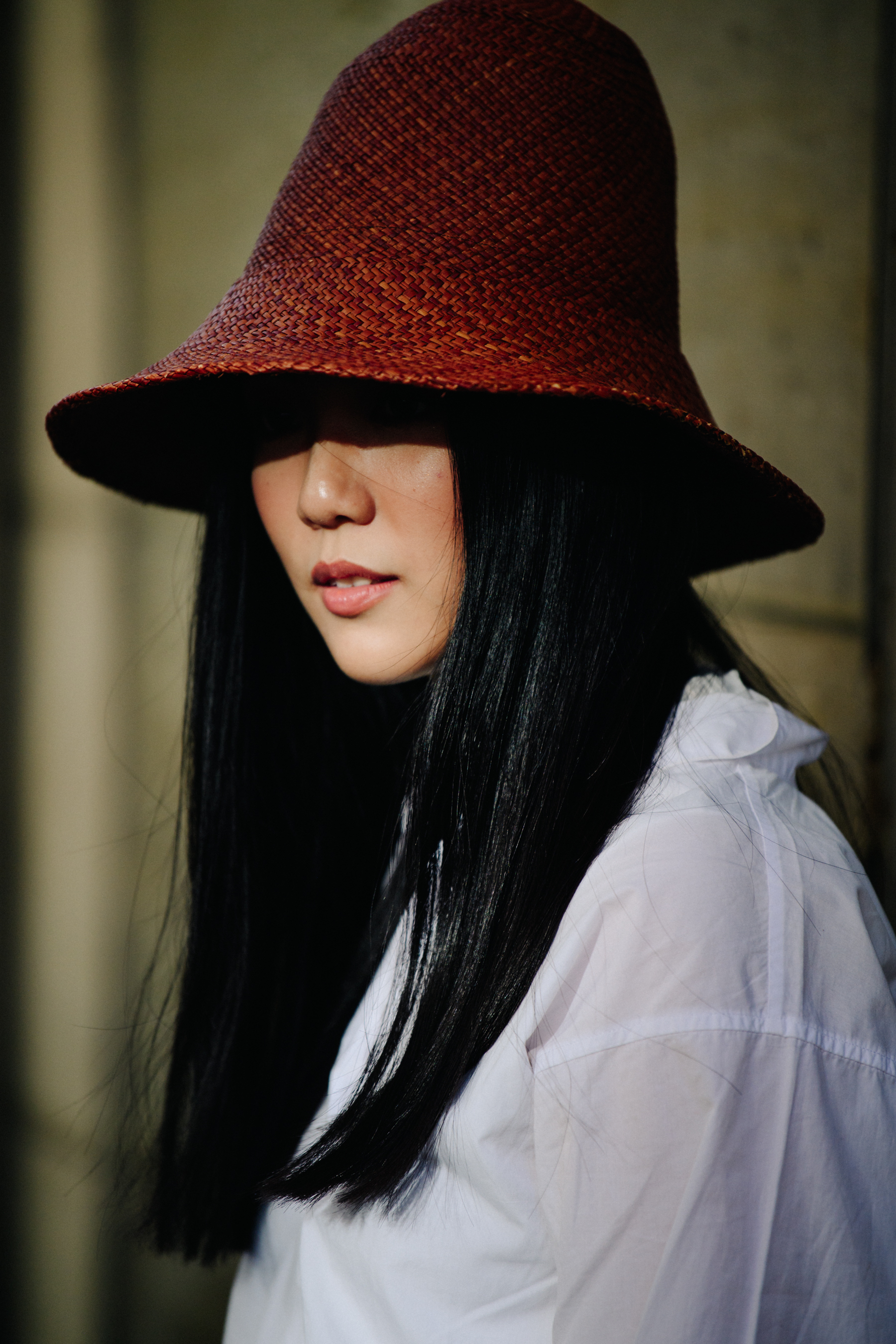 Woman wearing brown straw hat