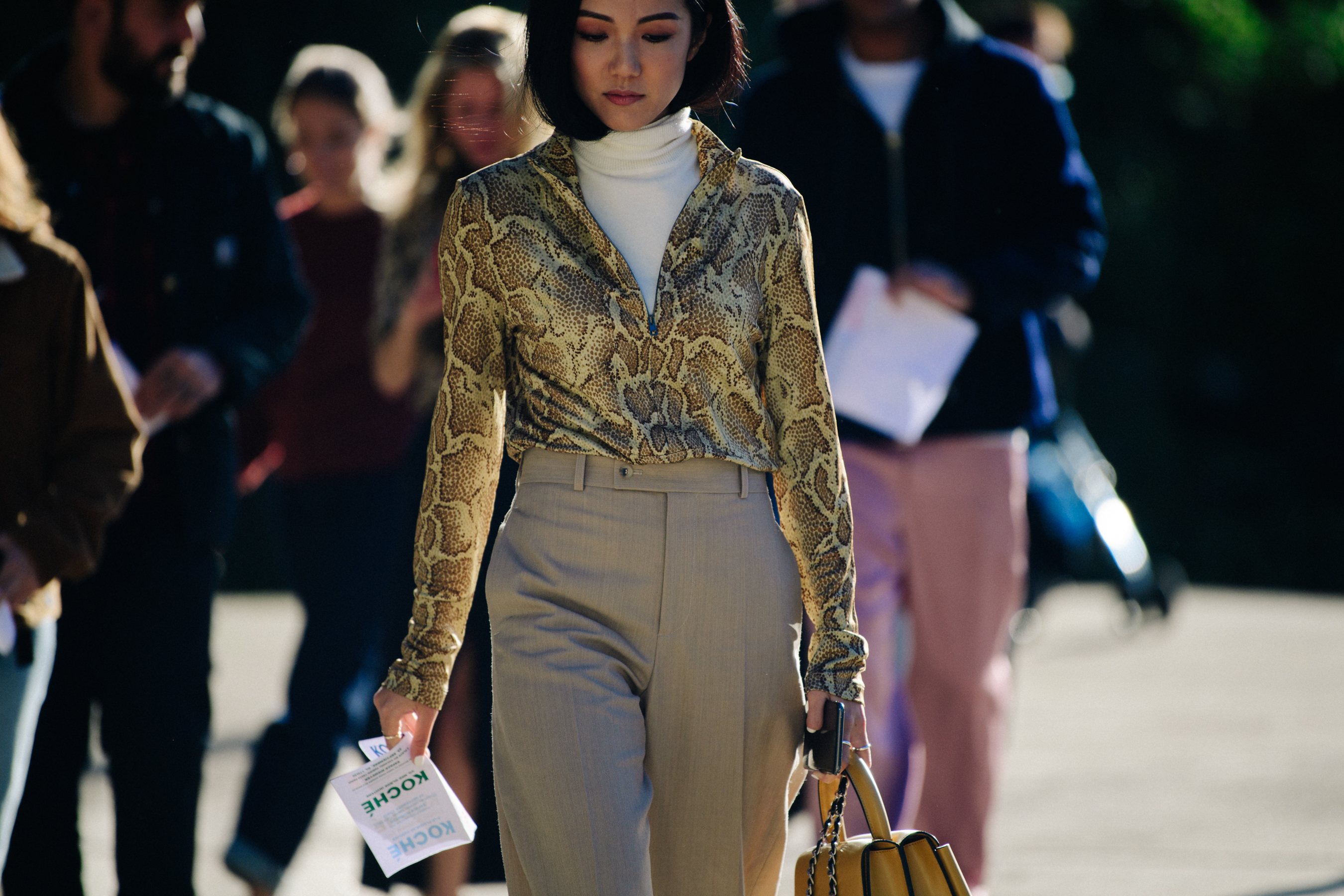 Woman wearing snakeskin pattern shirt