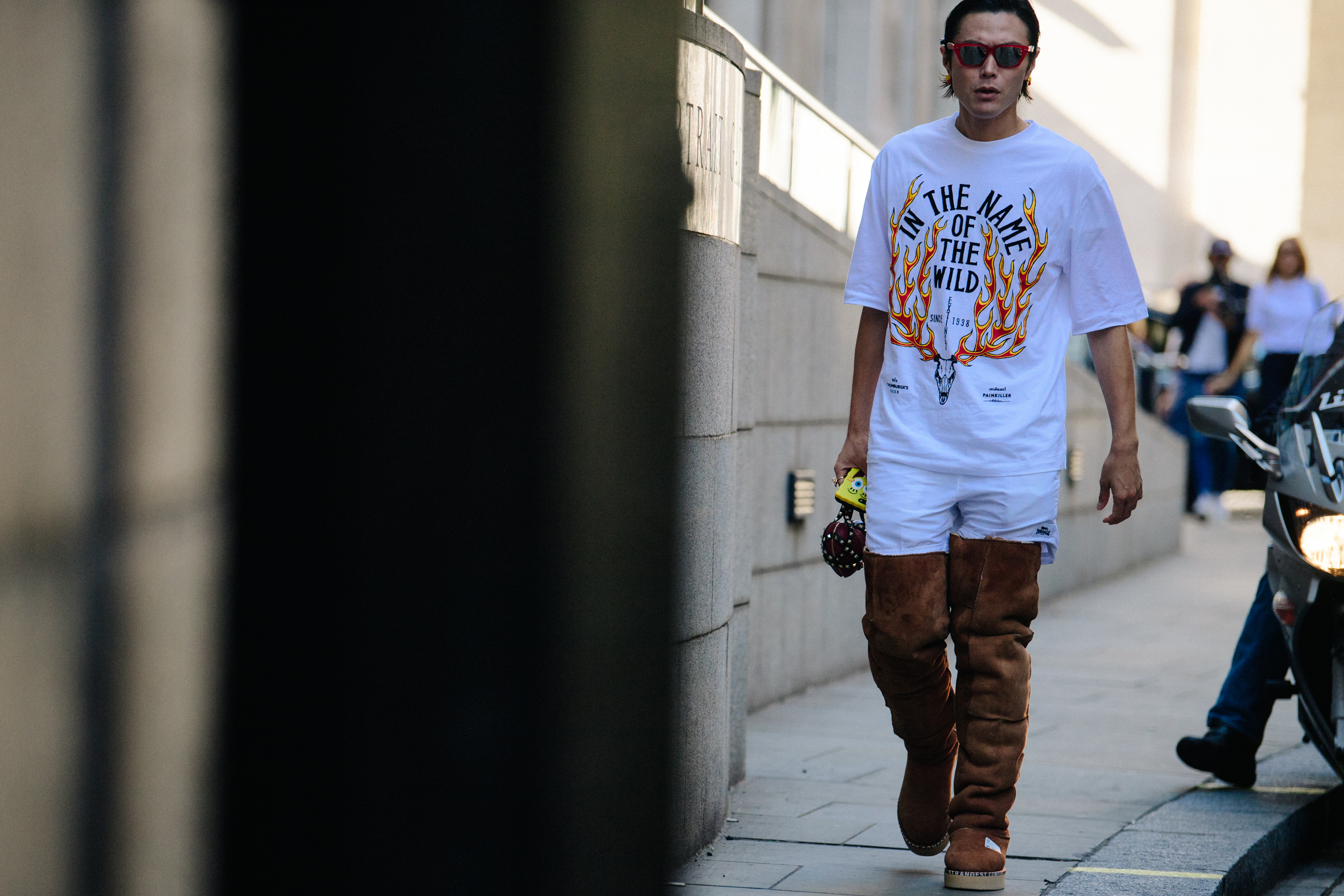 Japanese man wearing knee high Ugg boots