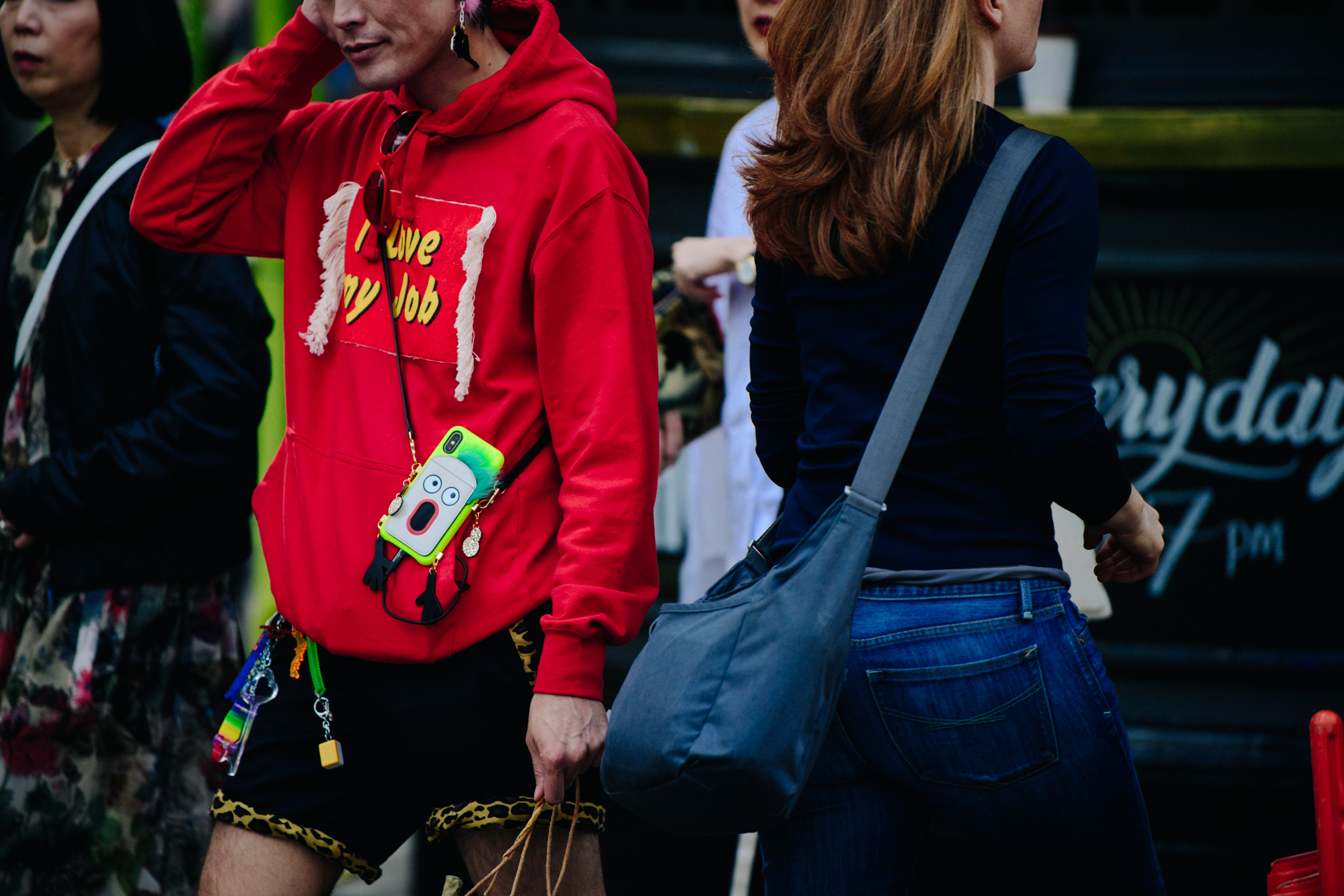 Asian man wearing red hoodie