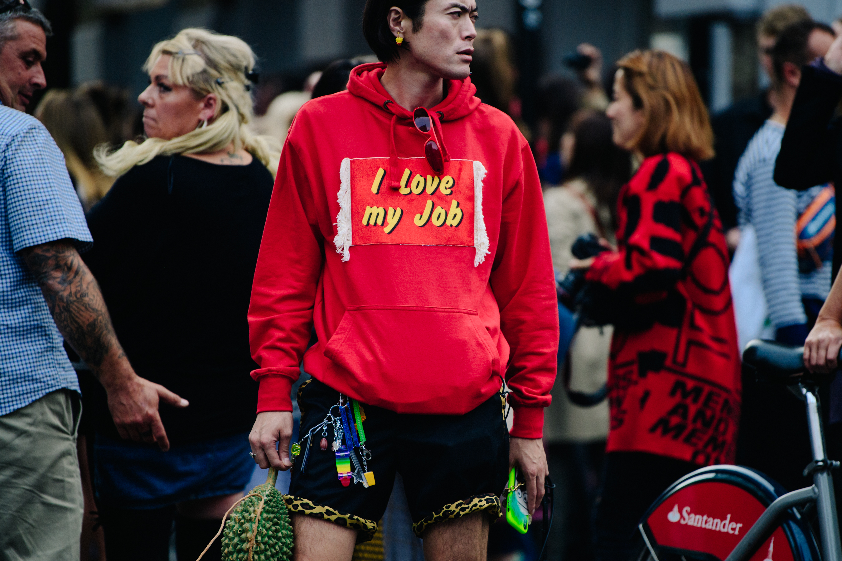 Asian man wearing red hoodie