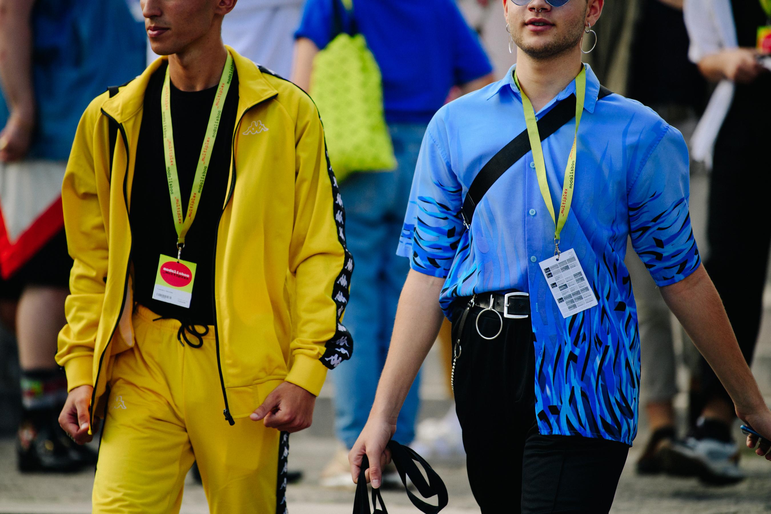 Two men wearing yellow and blue outfits