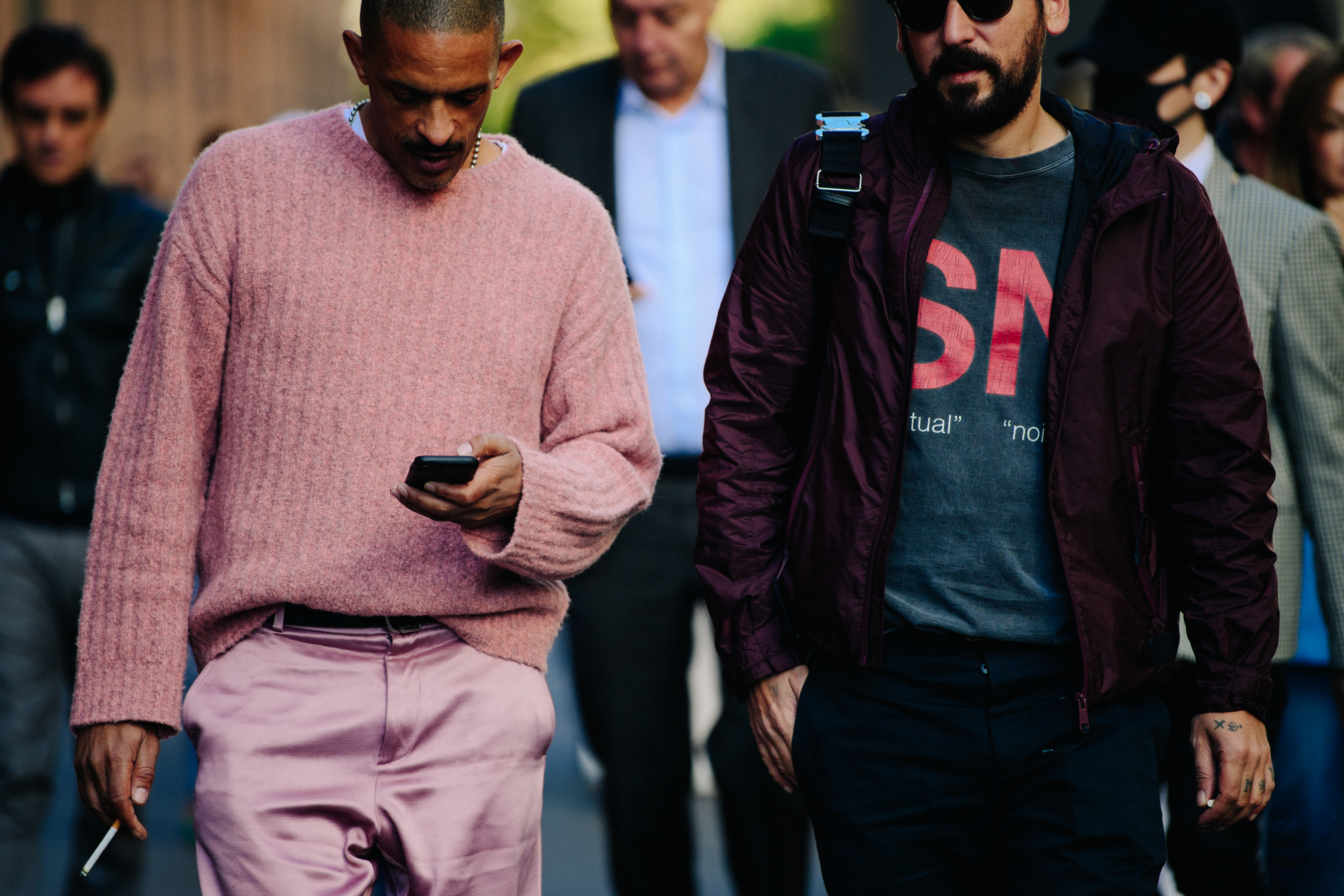 Two men wearing red and pink