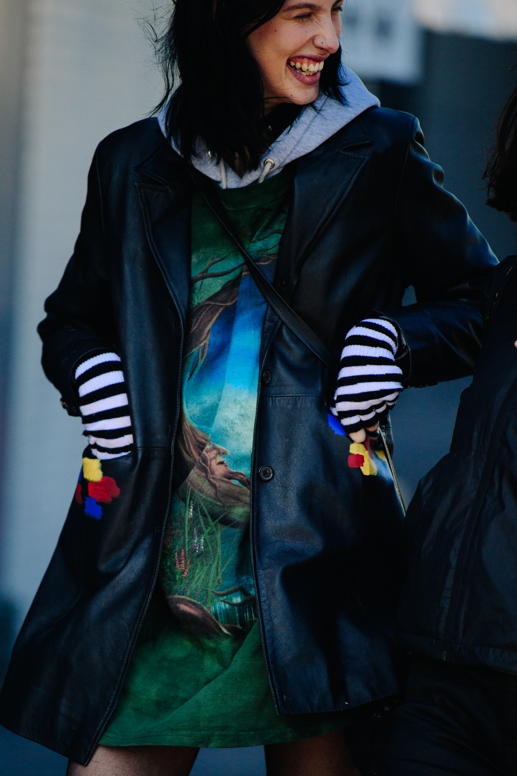 Model wearing striped gloves