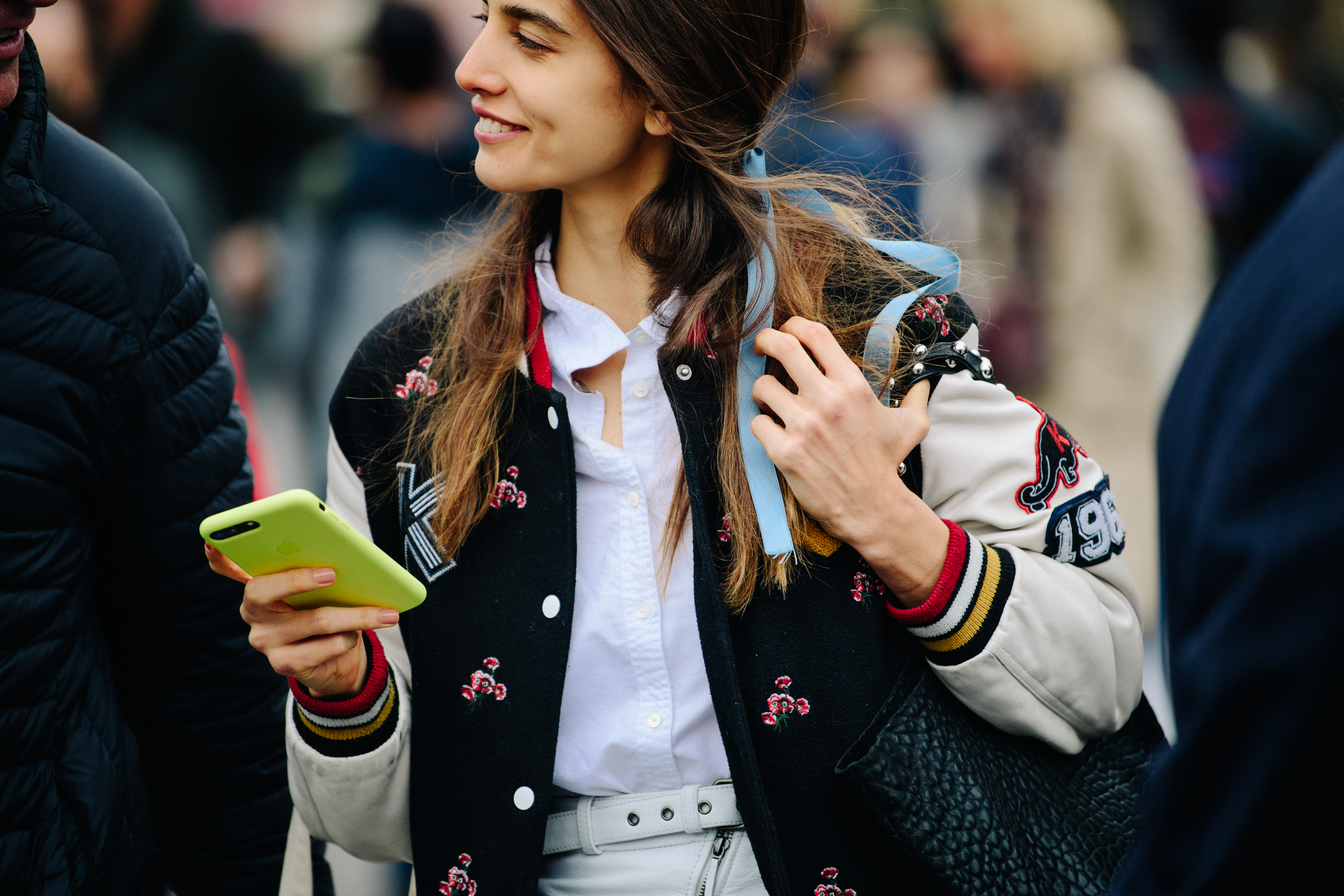 Woman wearing baseball jacket