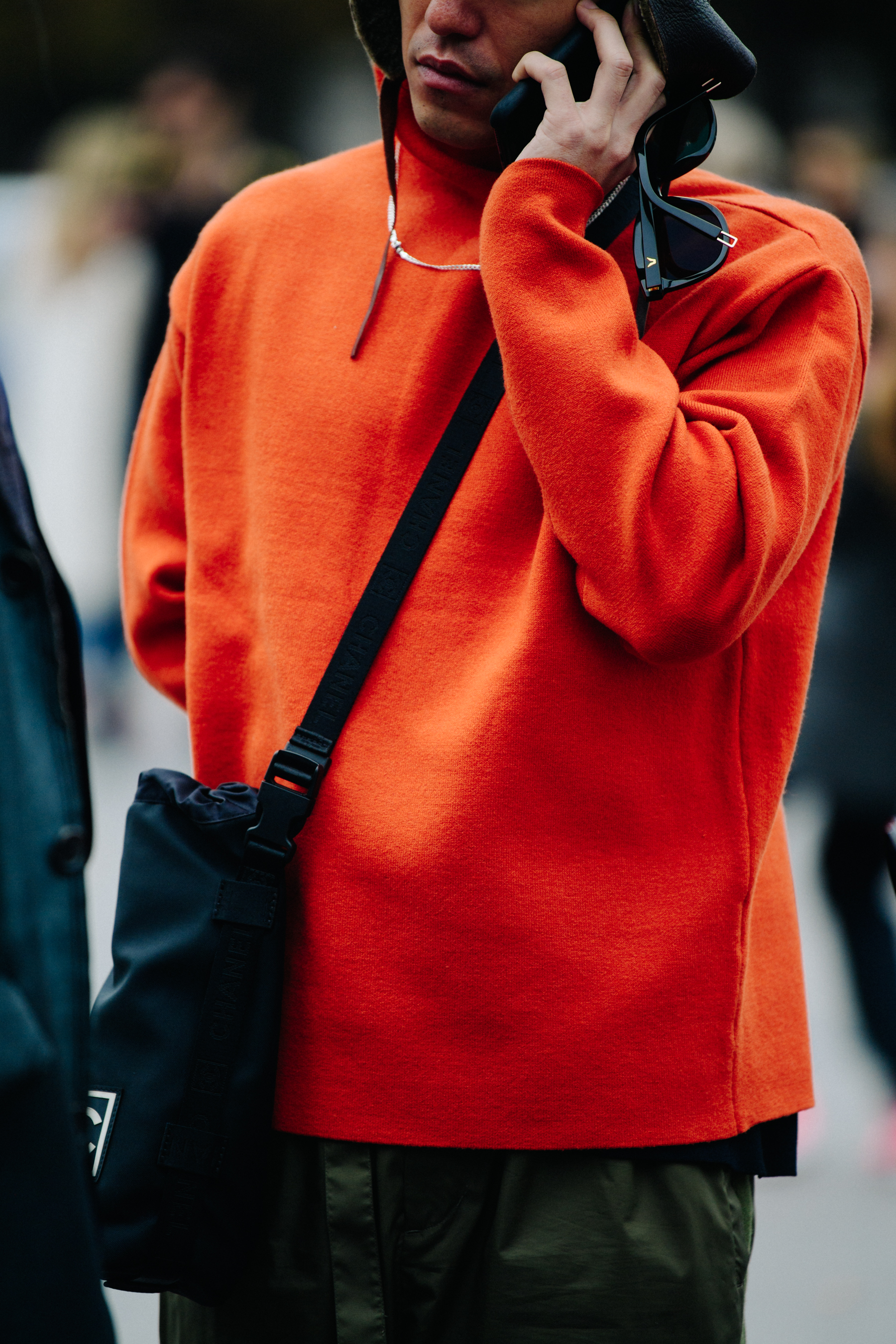 Man wearing orange jumper