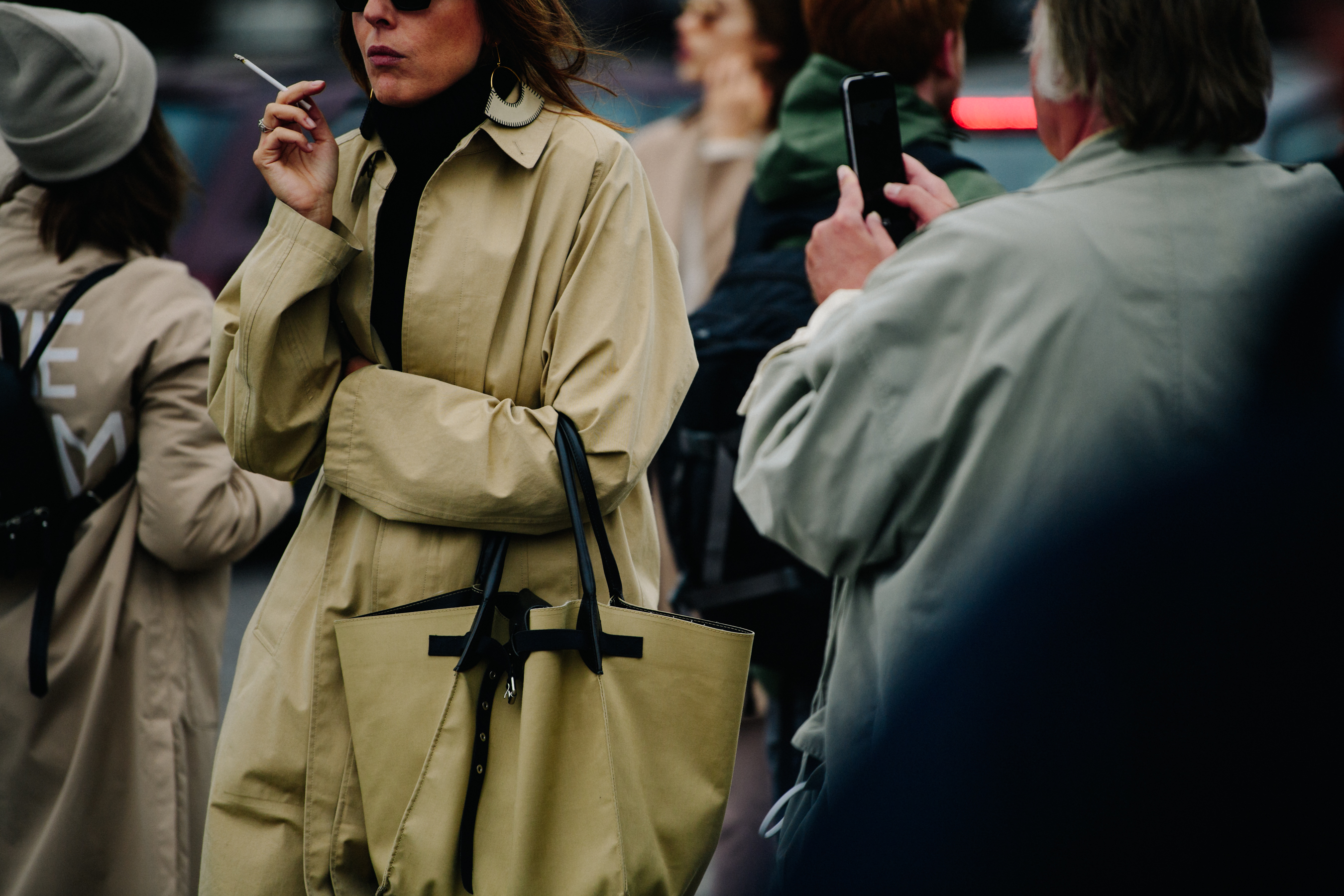 Woman wearing tan trench coat
