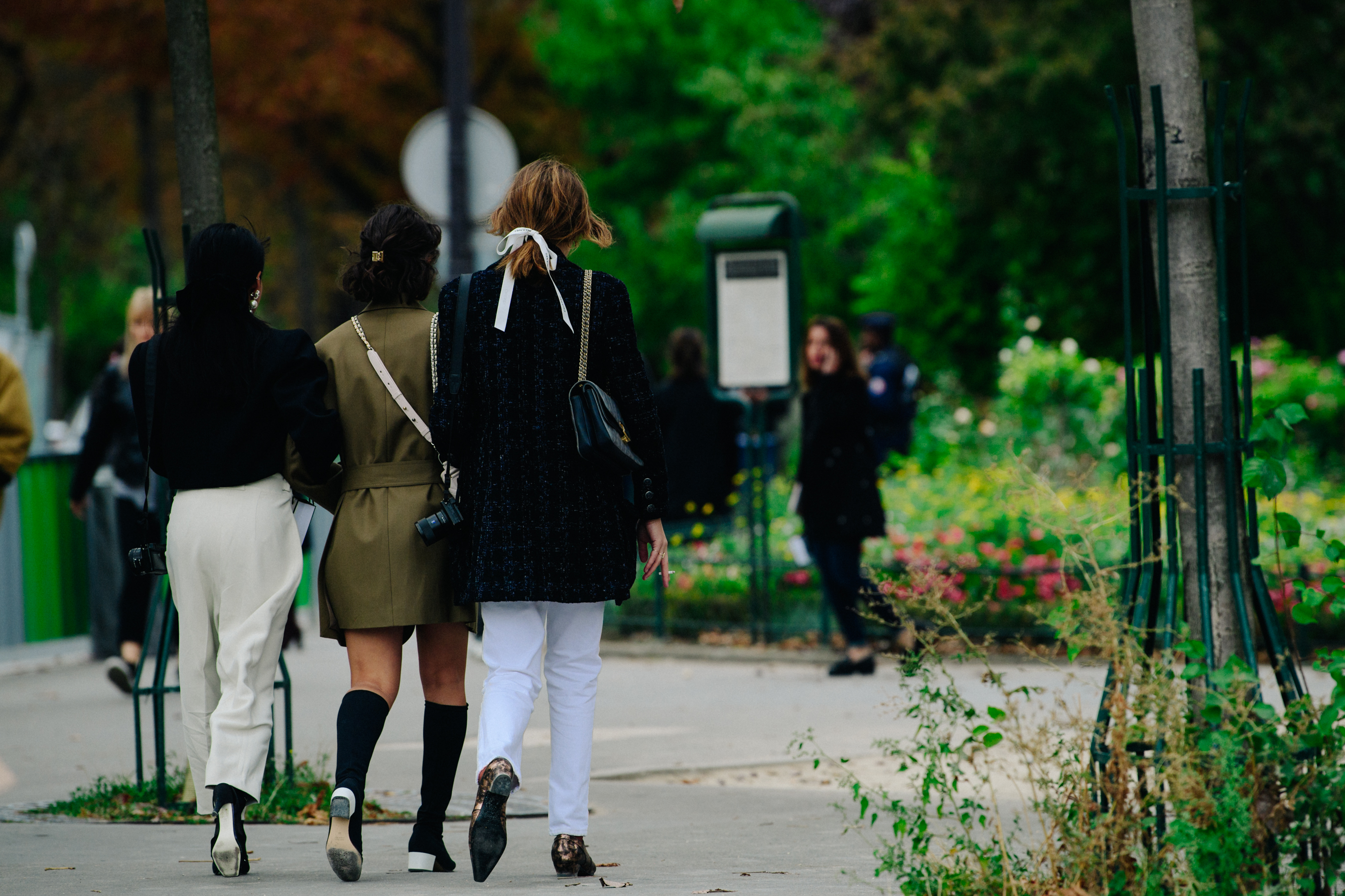 Three women wearing smart jackets