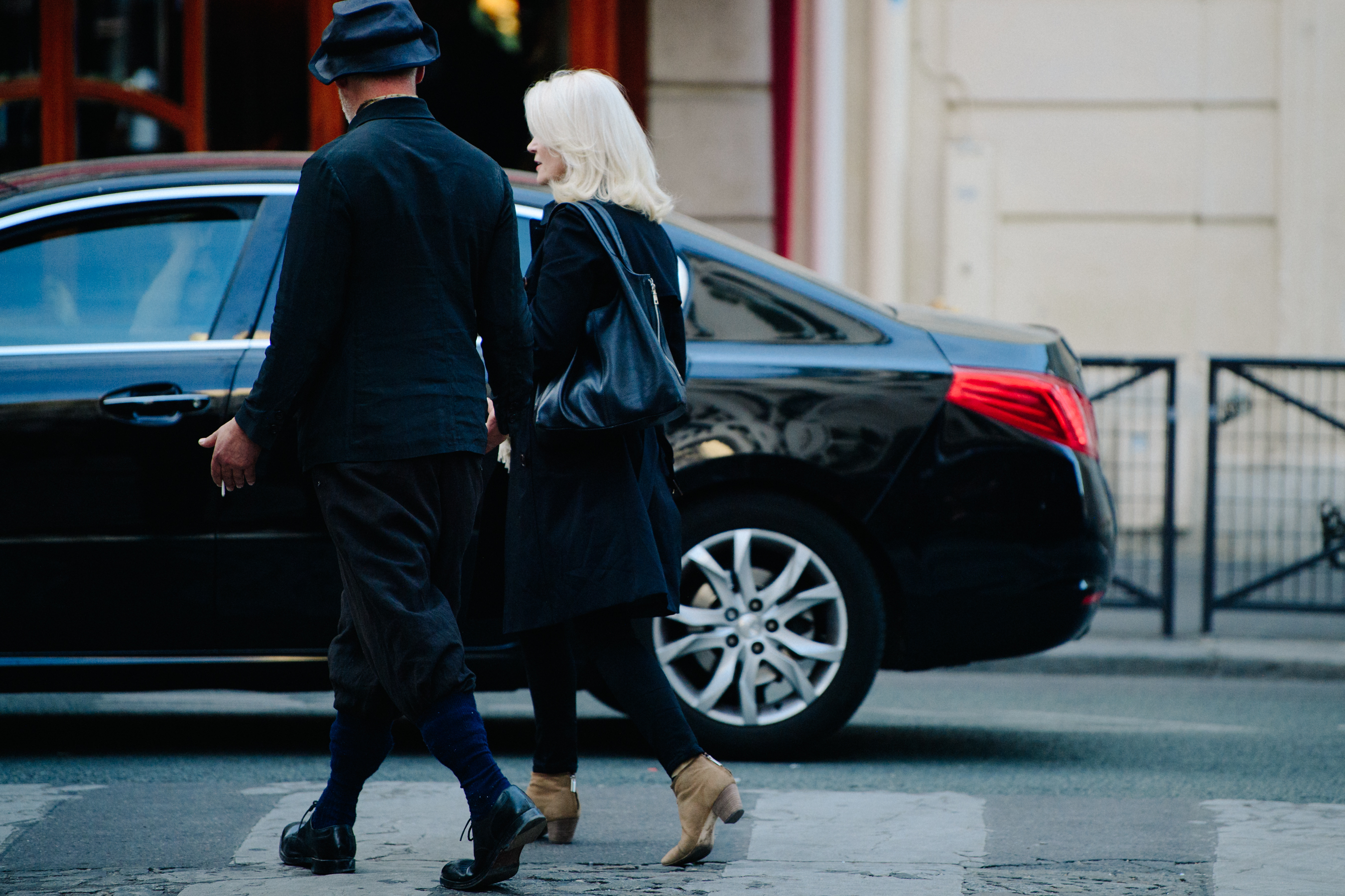 Couple wearing smart black outfits